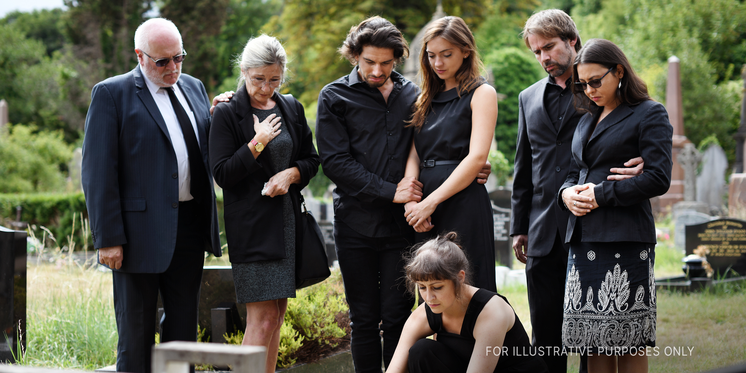 Family at cemetery | Source: Shutterstock