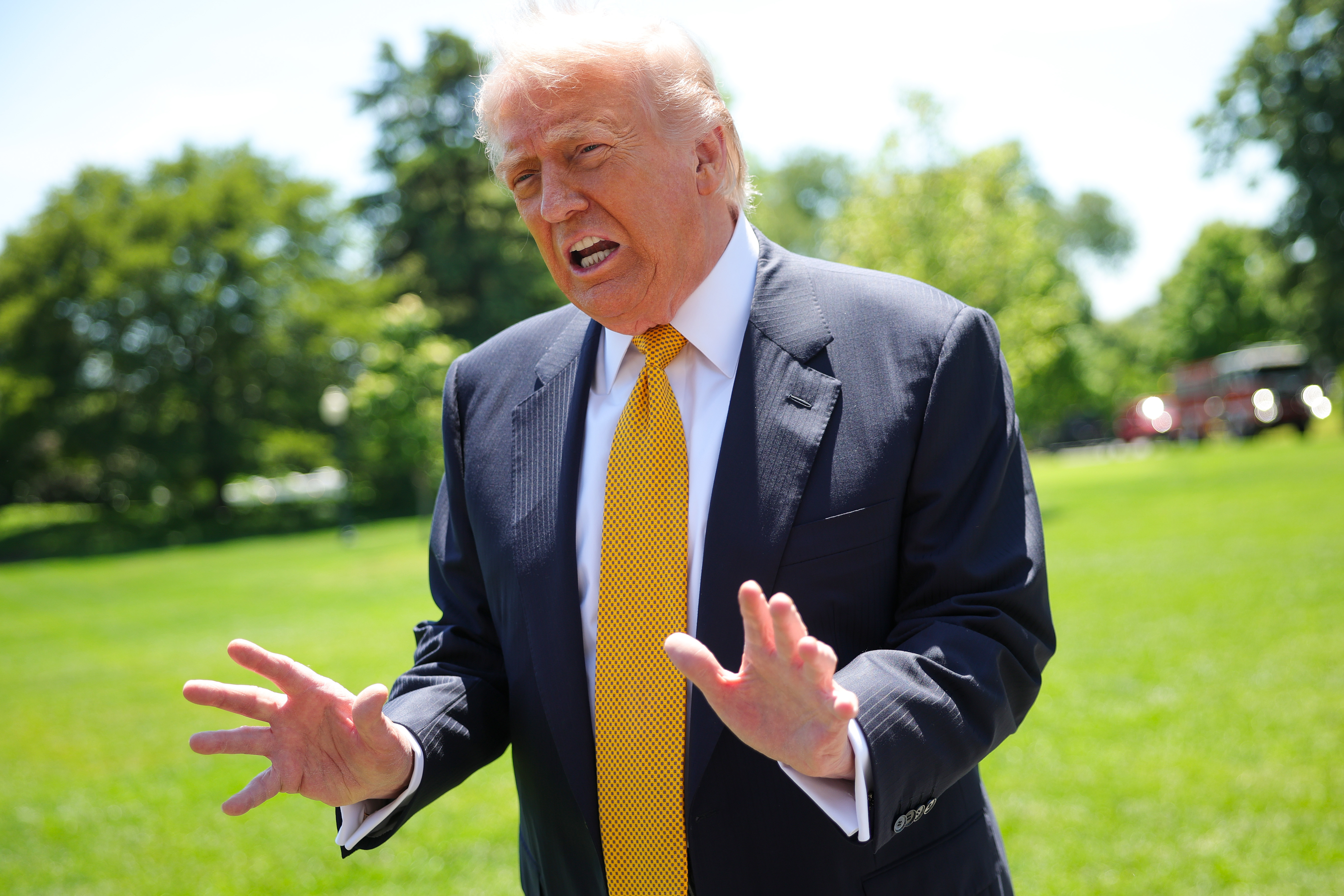 Donald Trump speaks to the press as he departs the White House on May 12, 2026 in Washington, DC | Source: Getty Images