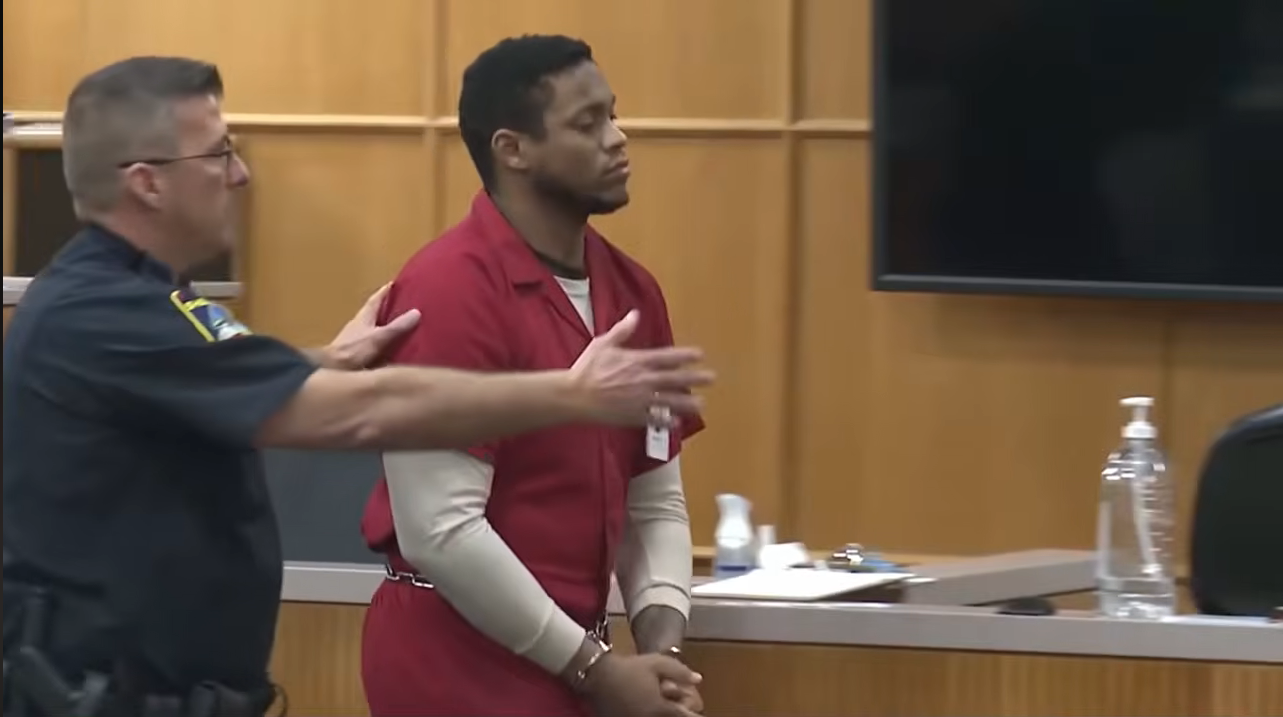 Darron Lee is led to his stand in court, from a video posted on March 10, 2026 | Source: YouTube/@newschannelnine