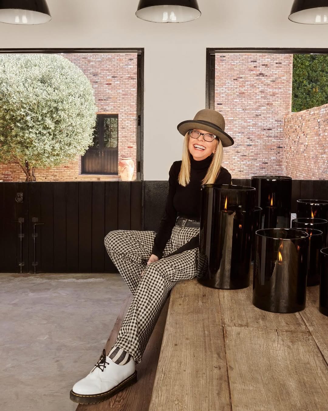Diane Keaton pictured inside her Sullivan Canyon home with brick exterior visible through the windows, dated August 15, 2024 | Source: Instagram/hudsongracesf