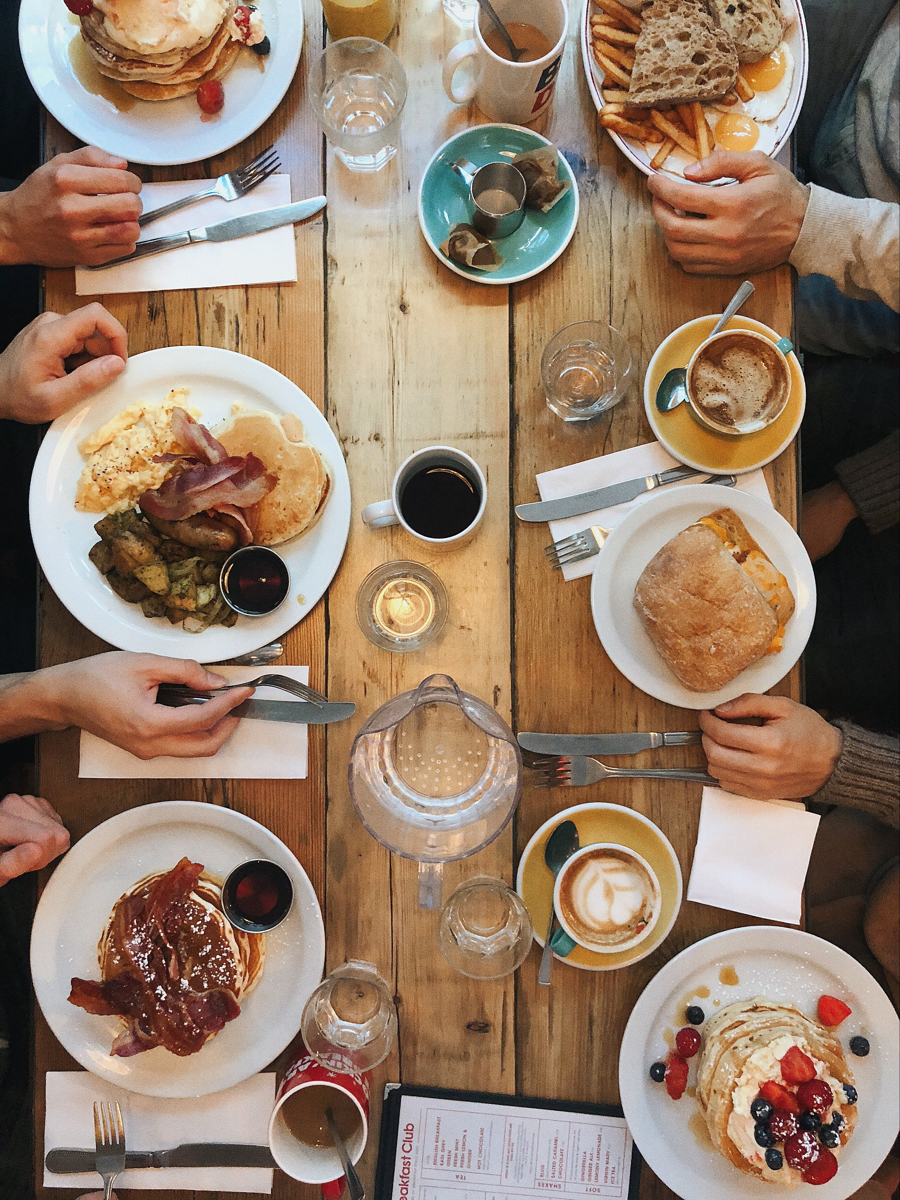 A long table filled with food. | Pexels