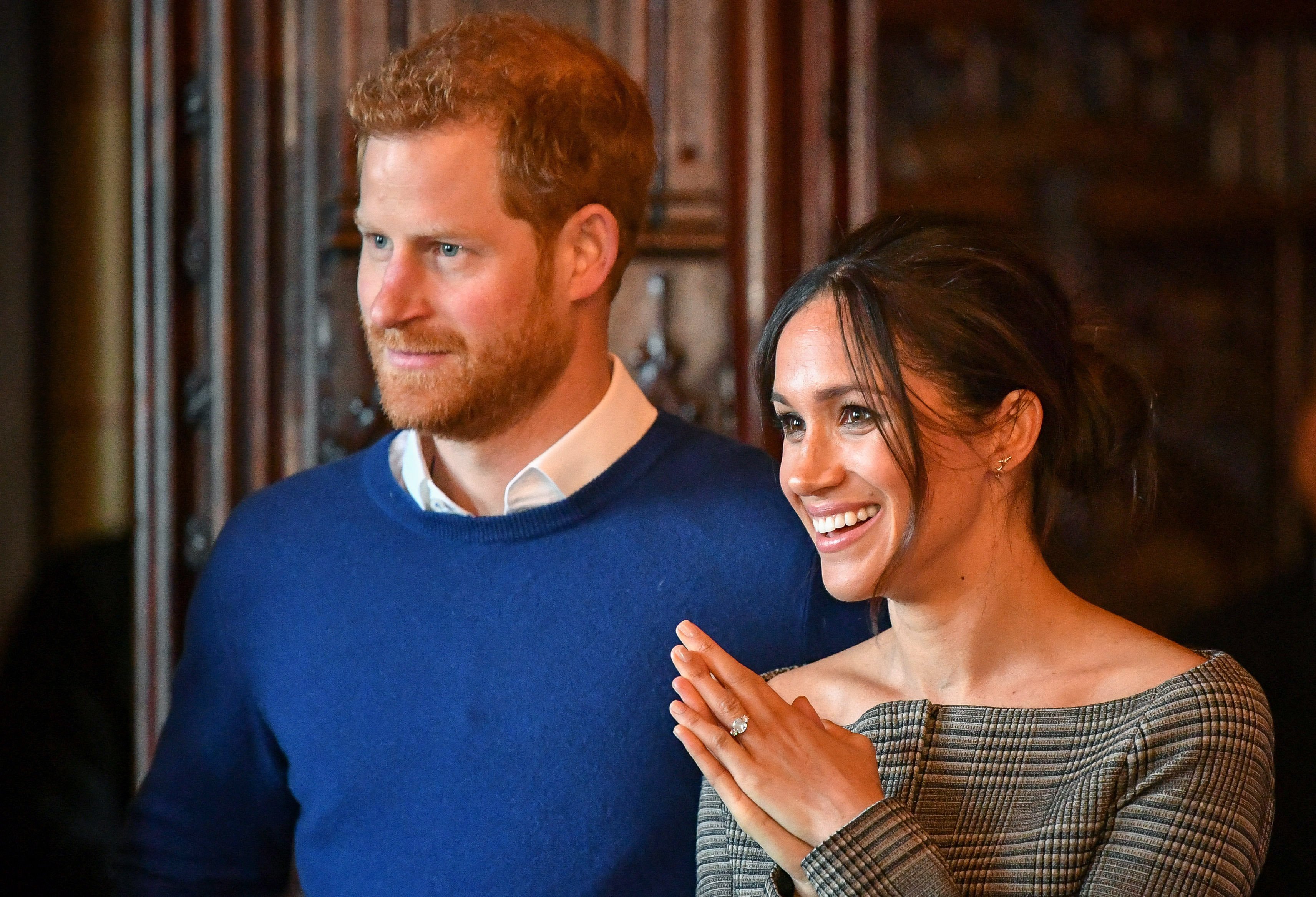 Prince Harry and Meghan Markle watch a performance by a Welsh choir in the banqueting hall during a visit to Cardiff Castle on January 18, 2018|Photo: Getty Images