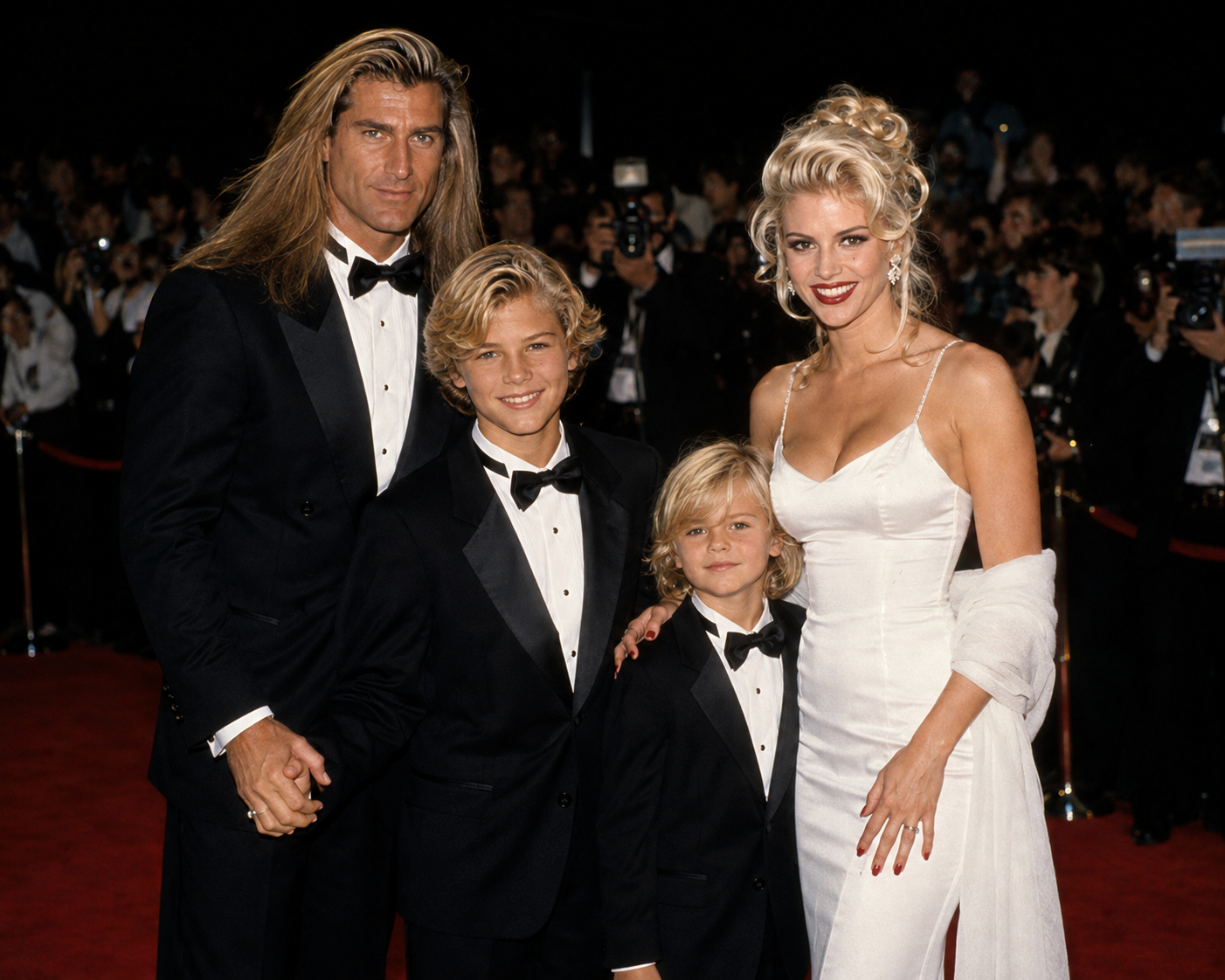 This AI creation depicts Fabio and Anna Nicole Smith arriving on a red carpet with their two imagined sons all dressed in formal black-tie wear, capturing a glamorous late 1990s family event. | Source: ChatGPT