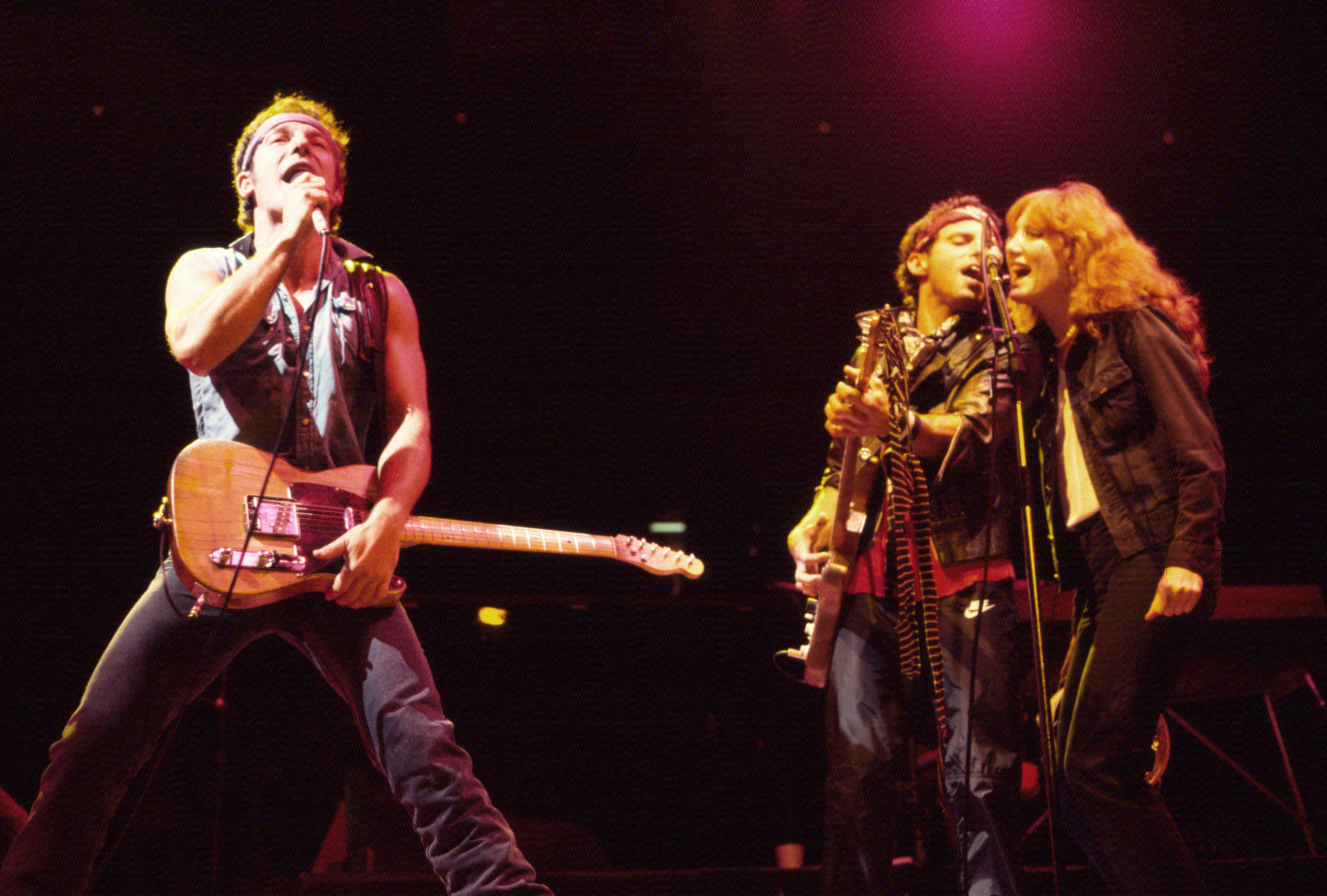 Bruce Springsteen and Patti Scialfa performing during their Born in the USA Tour, on August 12, 1984, in New Jersey | Source: Getty Images