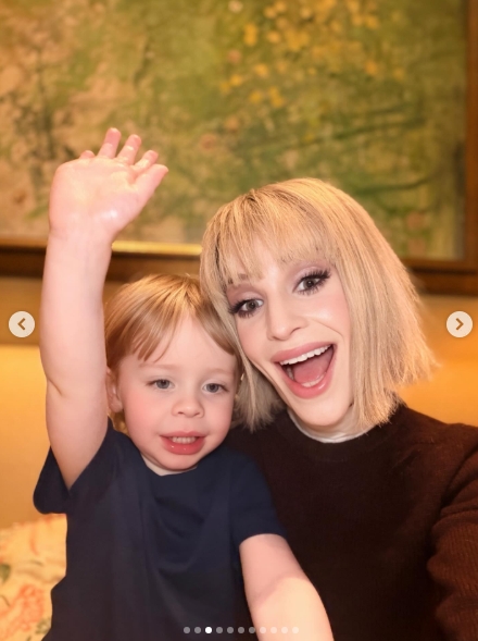 Kelly Osbourne, 41, and her three-year-old son are all smiles in this selfie shared on 5 April 2026, with the little one throwing his arm up mid-wave while his mum matches his energy with an open-mouthed grin. The pair were photographed inside The Dorchester hotel in London, where Osbourne had treated her son to an Easter Sunday afternoon tea. | Source: Instagram/kellyosbourne
