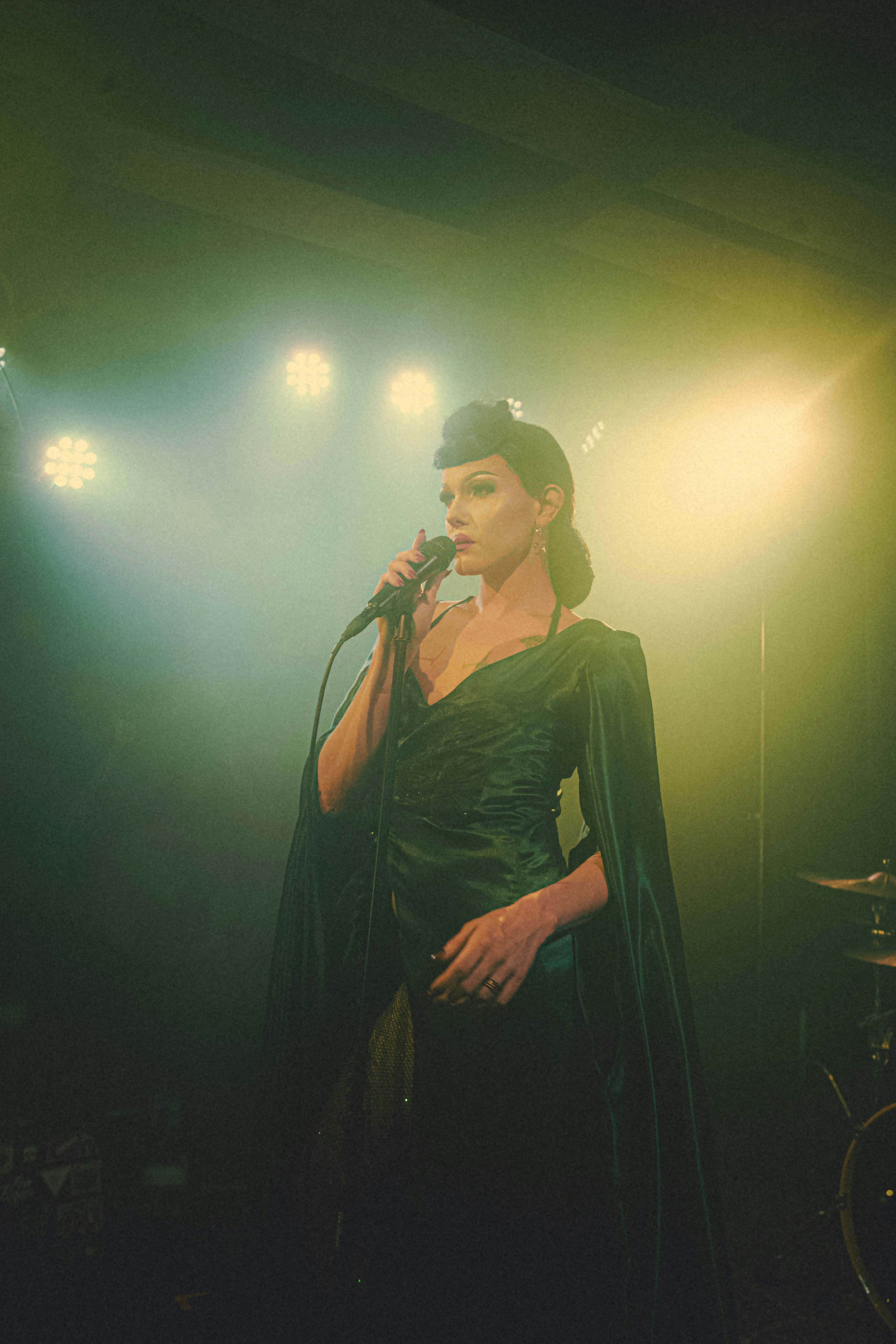 A serious woman speaking on a microphone | Source: Unsplash