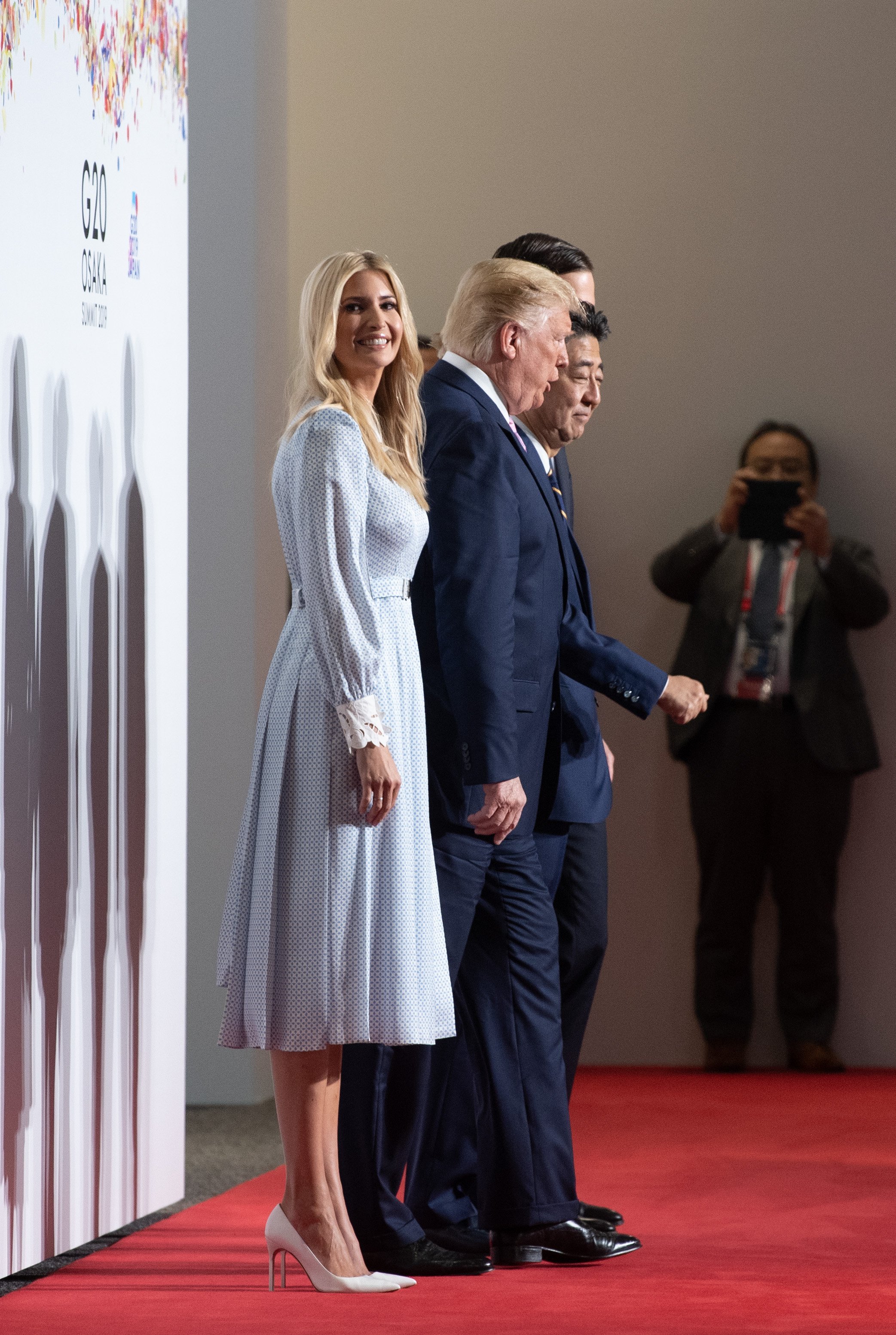Ivanka Trump with Donald Trump and Japan's Prime Minister Shinzo Abe posing for a group photo at the G20 summit in Osaka, Japan | Photo: Getty Images