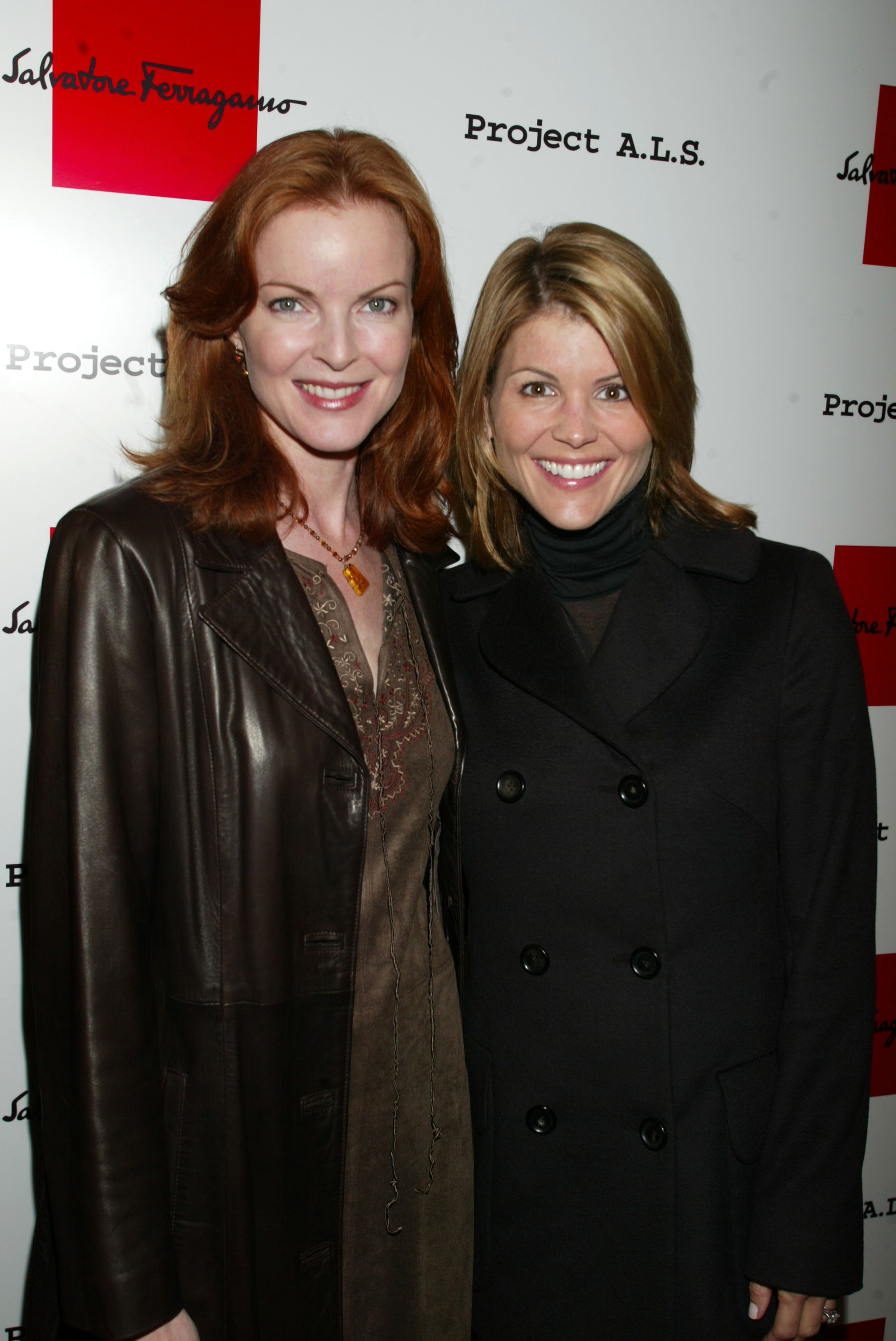 Marcia Cross and Lori Loughlin at Salvatore Ferragamo's Beverly Hills store on October 16, 2002, in Beverly Hills, California. | Source: Getty Images