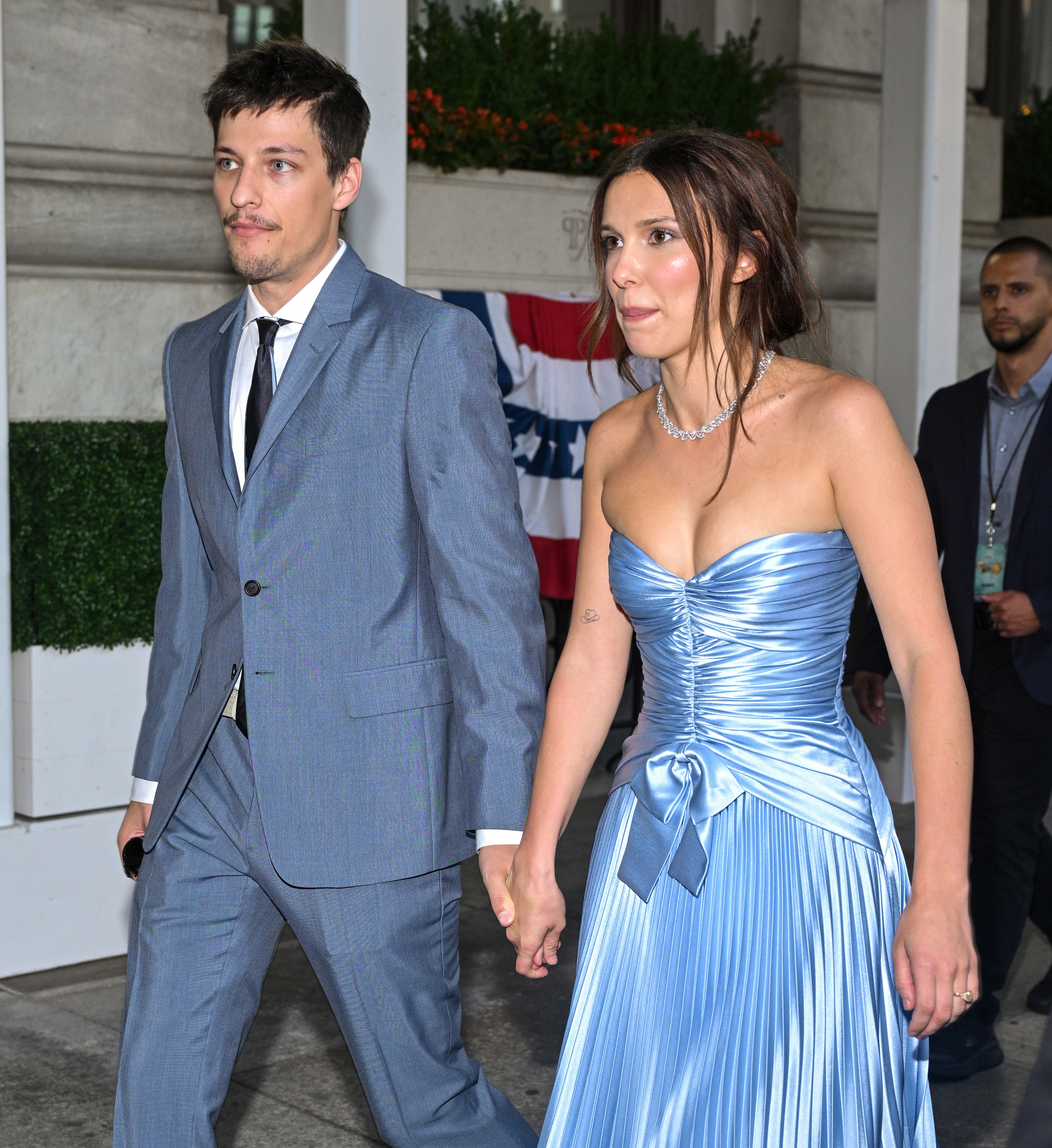 Millie Bobby Brown and Jake Bongiovi arrive together at the "Enola Holmes 3" world premiere in New York City on June 25, 2026. Their coordinated blue outfits became a major topic of conversation across Reddit, TikTok, and Instagram after photos from the event were shared online. | Source: Getty Images