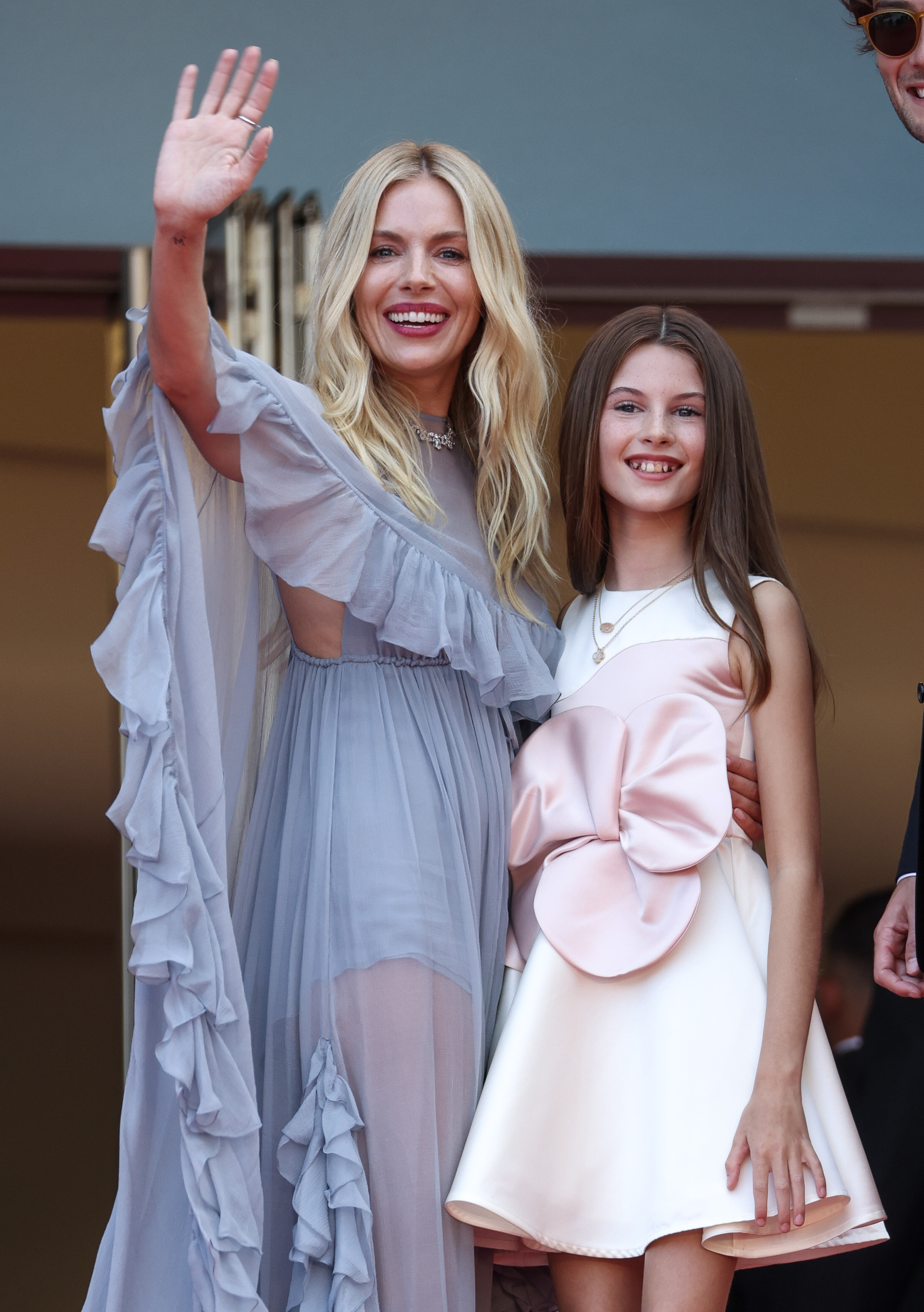 Sienna Miller and Marlowe Sturridge attend the "Horizon: An American Saga" Red Carpet at the 77th annual Cannes Film Festival at Palais des Festivals on 19 May 2024 in Cannes, France. | Source: Getty Images