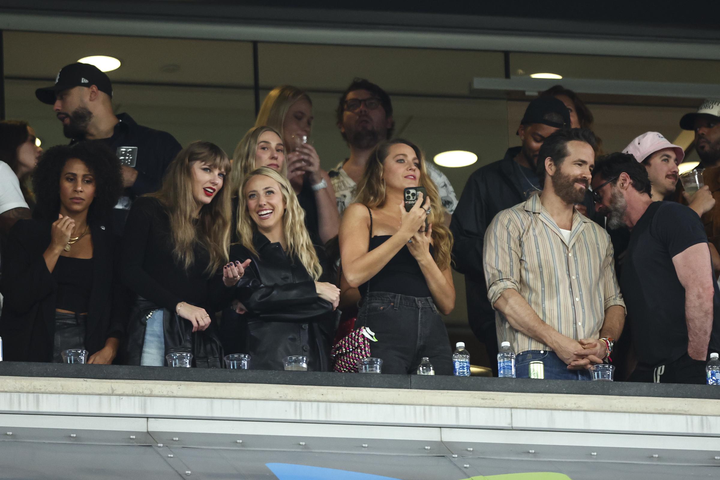 Taylor Swift, Brittany Mahomes, Blake Lively, Hugh Jackman, and Ryan Reynolds watch from the stands during an NFL football game on October 1, 2023, in East Rutherford, New Jersey. | Source: Getty Images