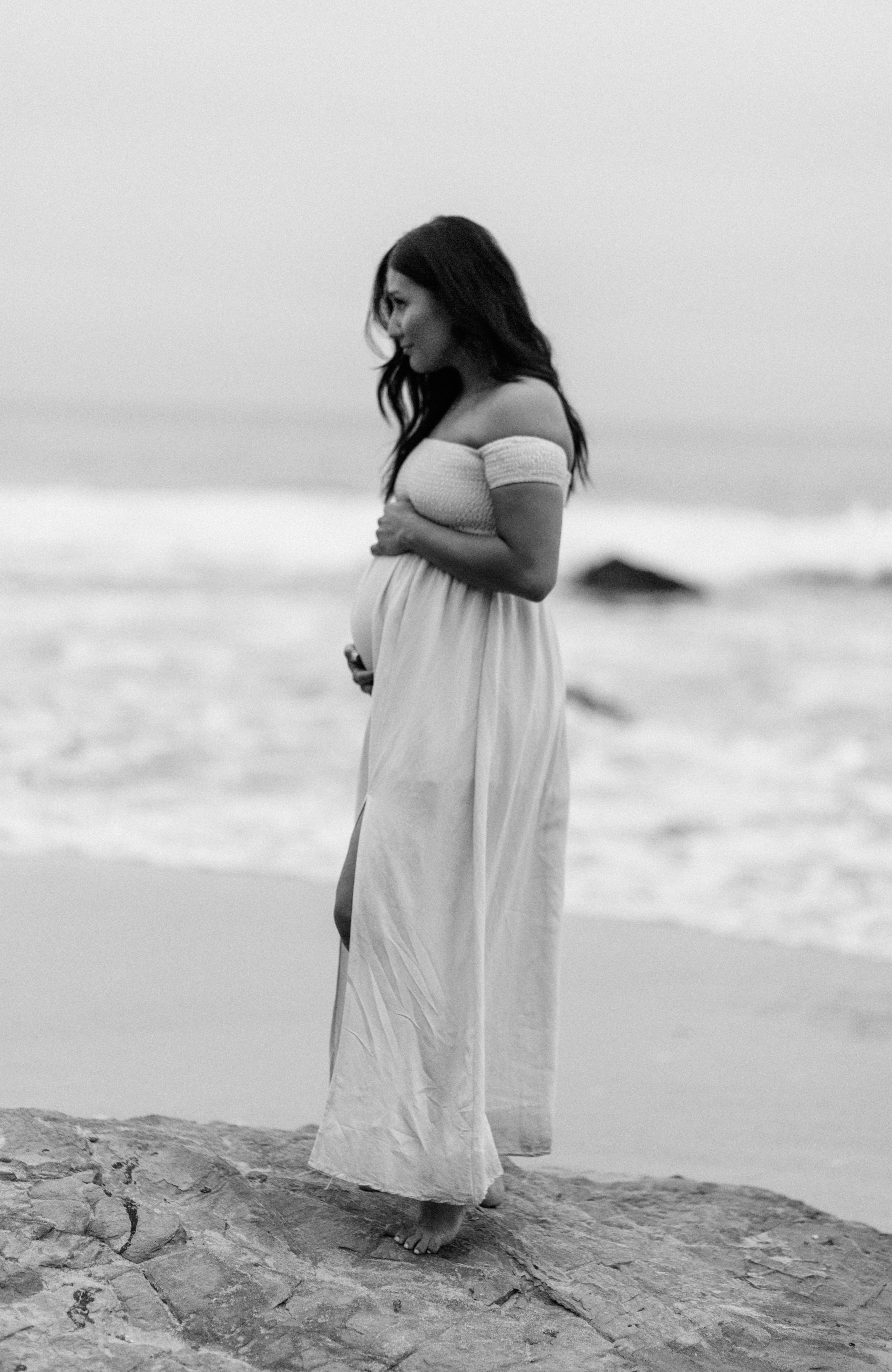 A pregnant woman by the beach | Source: Unsplash