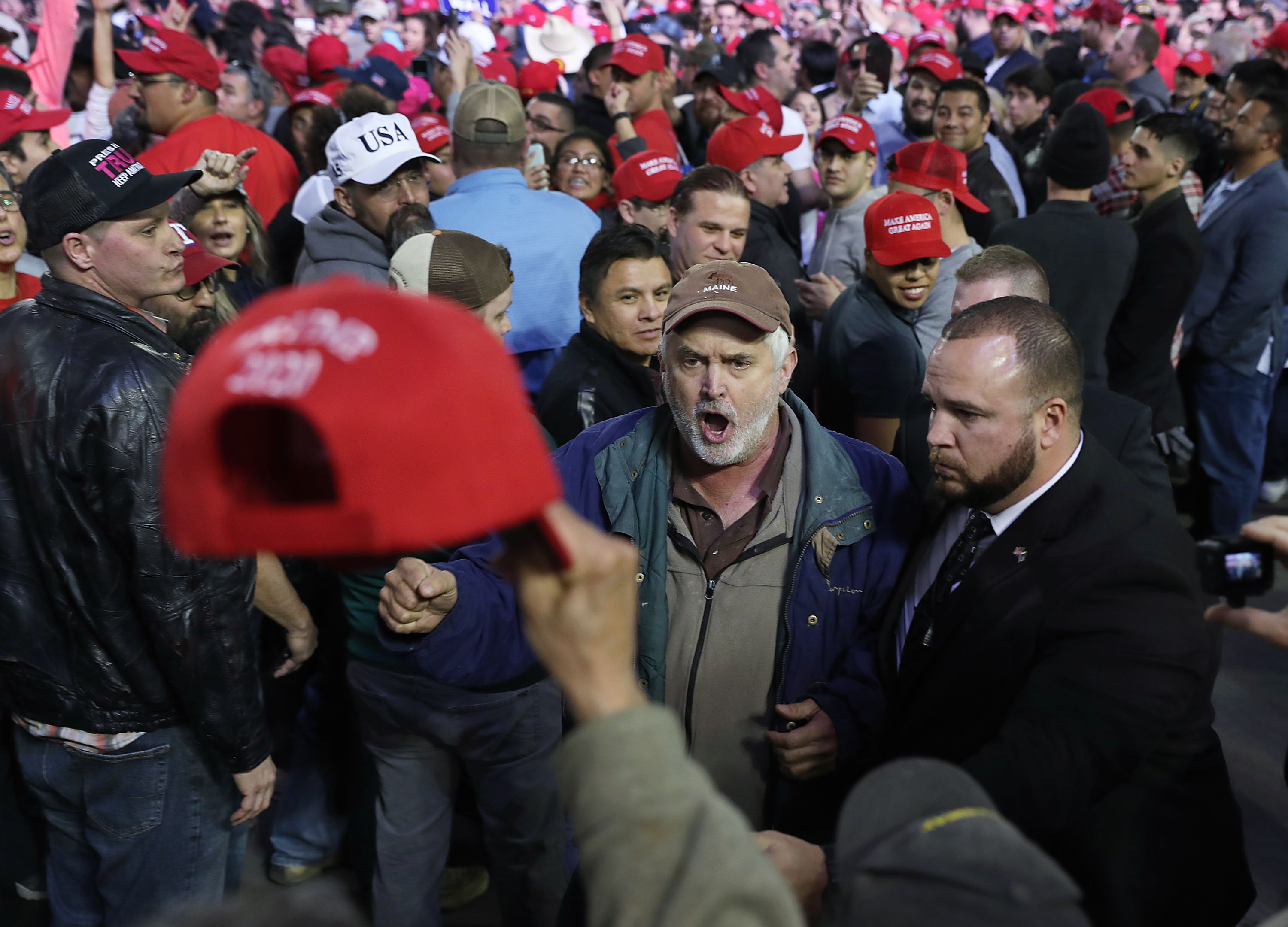 Protester being escorted out by security at Donald Trump's El Paso Rally | Photo: Getty Images