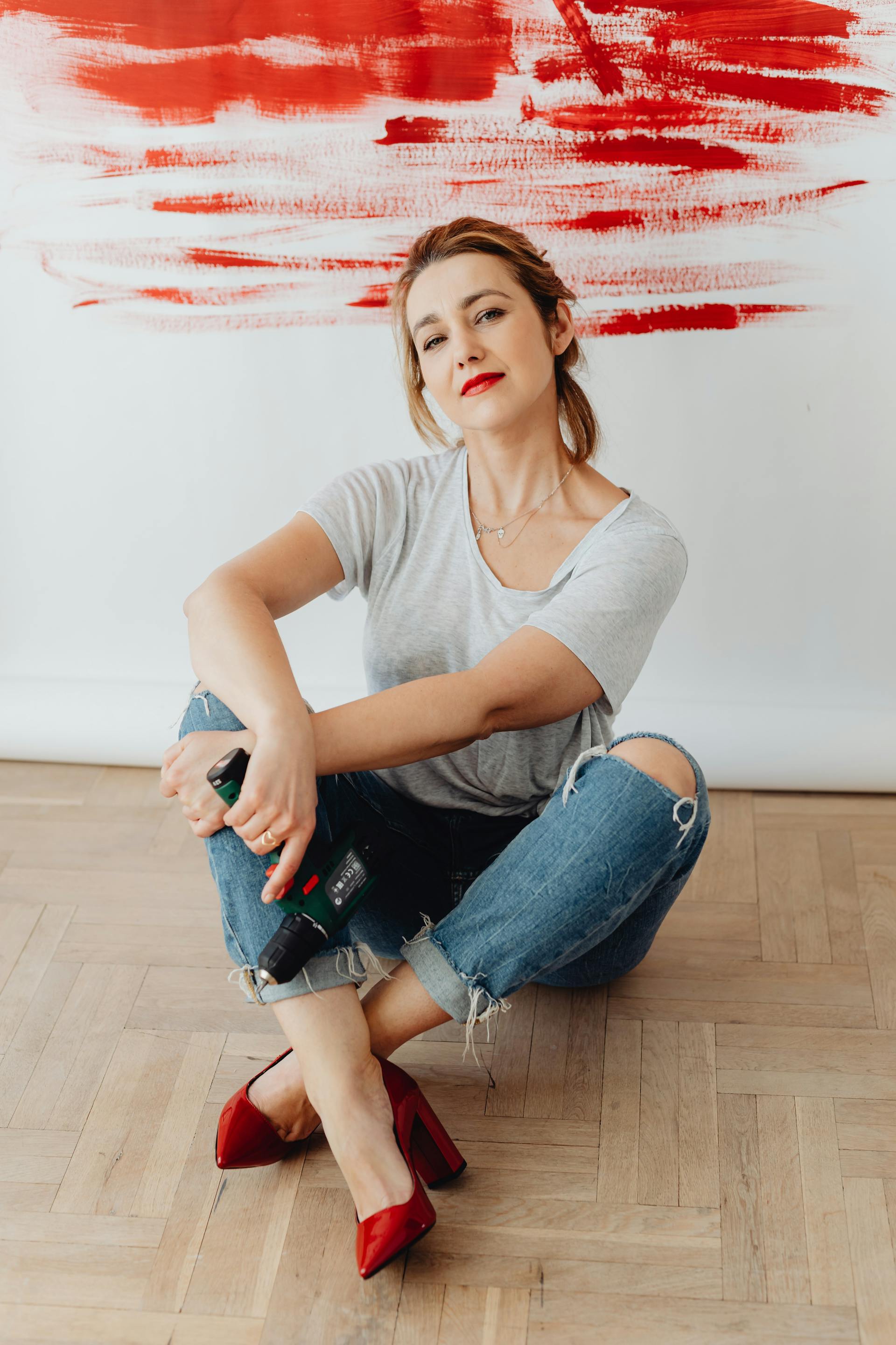 A woman wearing heels and red lipstick | Source: Pexels