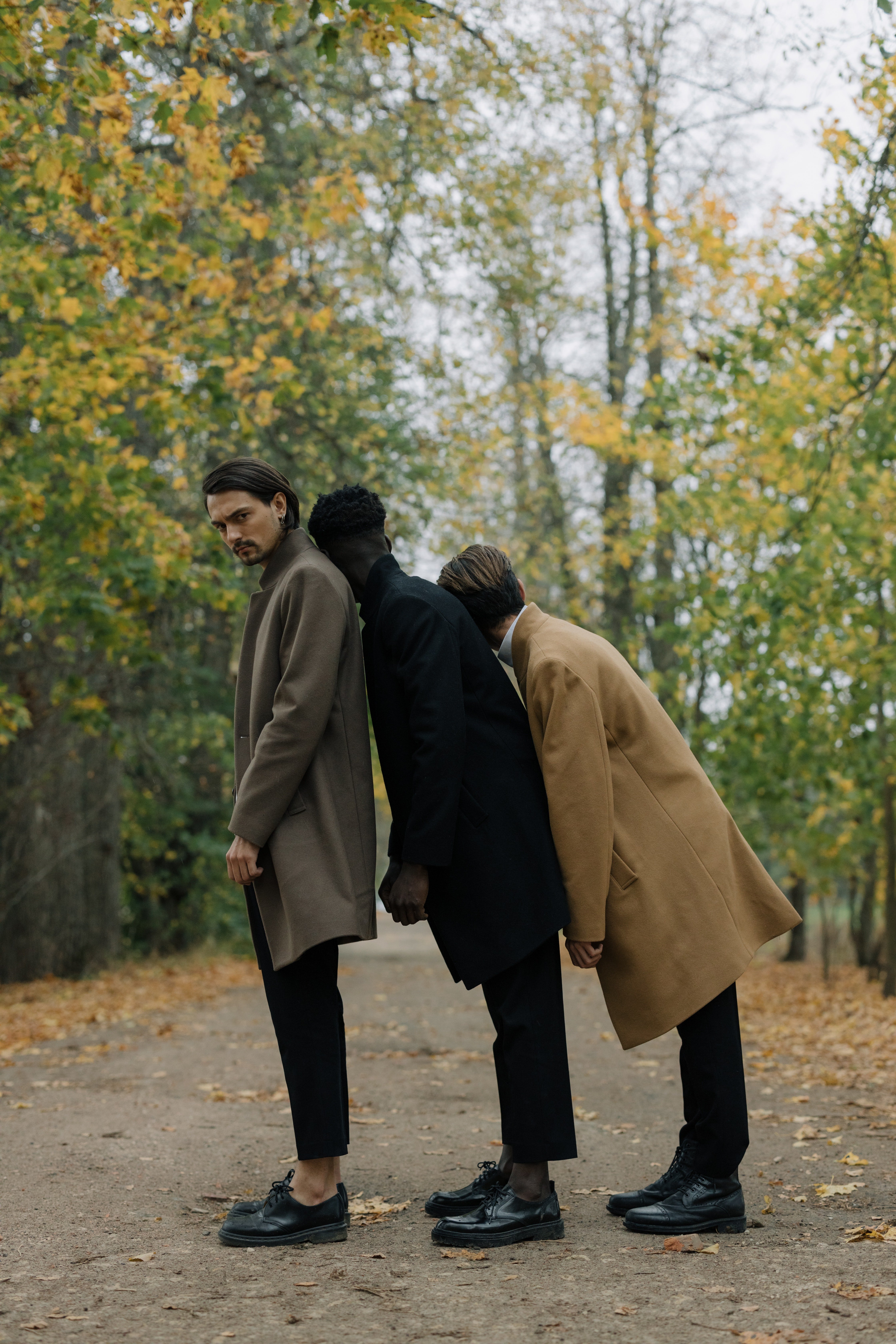 Pictured - The males standing near trees | Source: Pexels 
