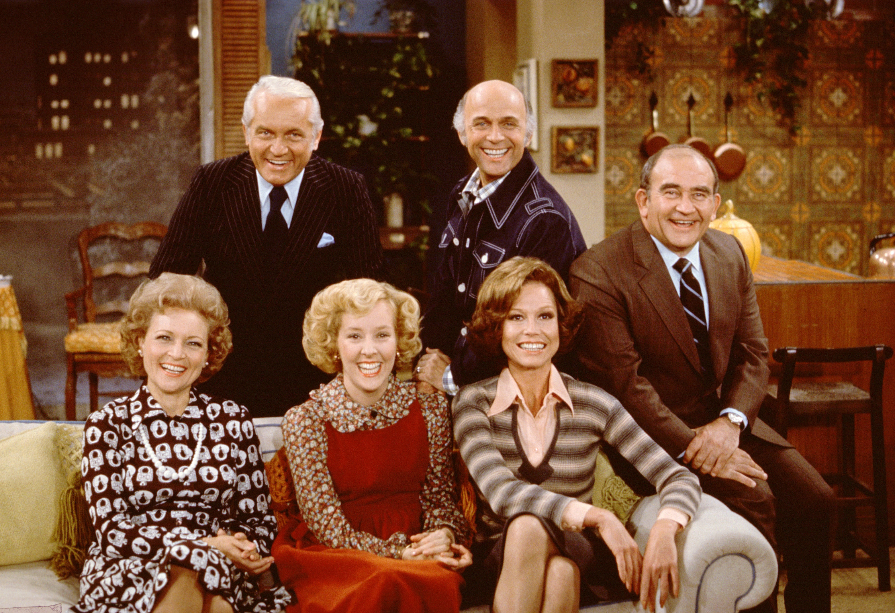 Betty White, as Sue Ann Nivens, Ted Knight as Ted Baxter, Georgia Engel as Georgette Franklin Baxter, Gavin McLeod as Murray Slaughter, Mary Tyler Moore as Mary Richards, and Ed Asner as Lou Grant pictured on the set of "The Mary Tyler Moore Show." | Source: Getty Images