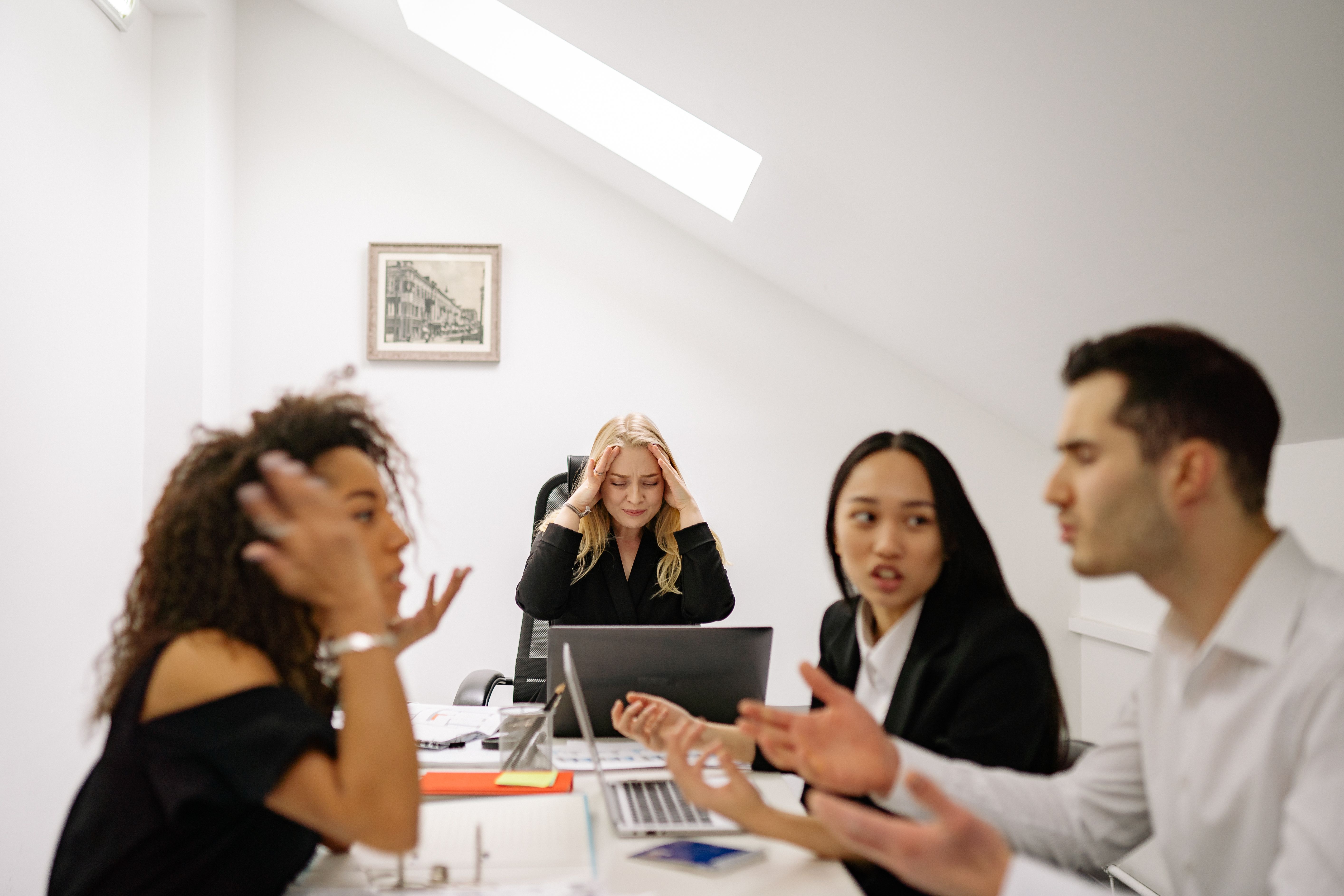 A group of co-workers arguing during a meeting | Source: Pexels