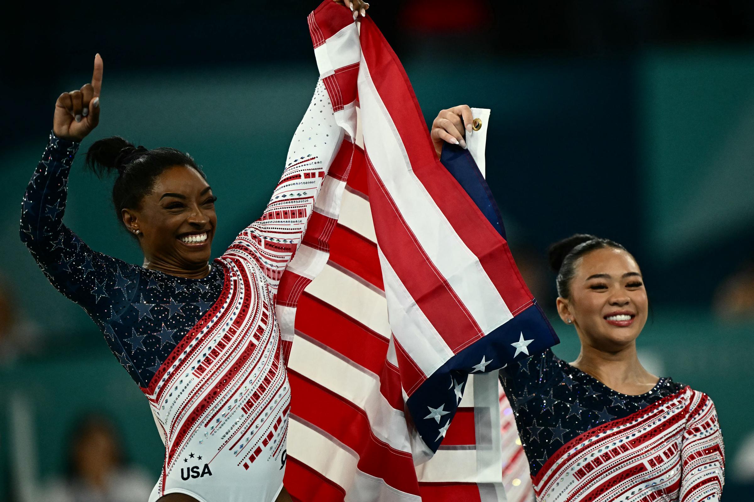 Simone Biles and Sunisa Lee celebrate after Team USA wins the Women’s Team Final at the Paris 2024 Olympics on July 30, 2024 | Source: Getty Images