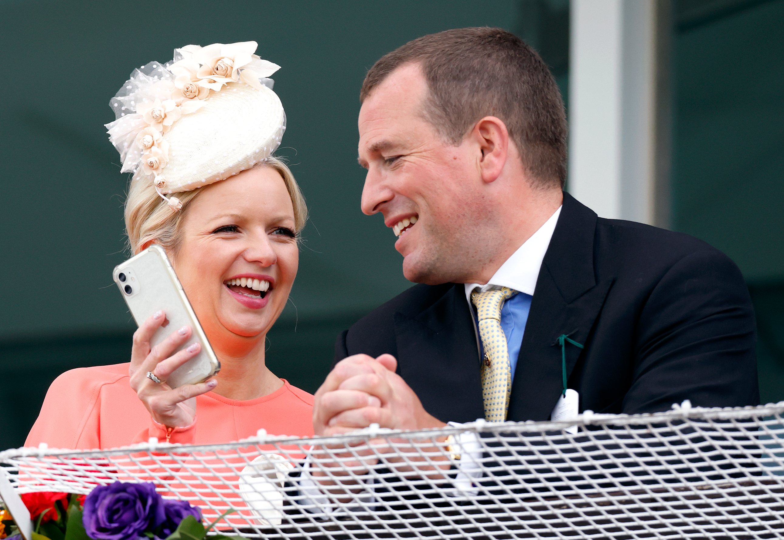 Lindsay Wallace and Peter Phillips watching the race from the royal box at The Epsom Derby at Epsom Racecourse on June 4, 2022 | Source: Getty Images