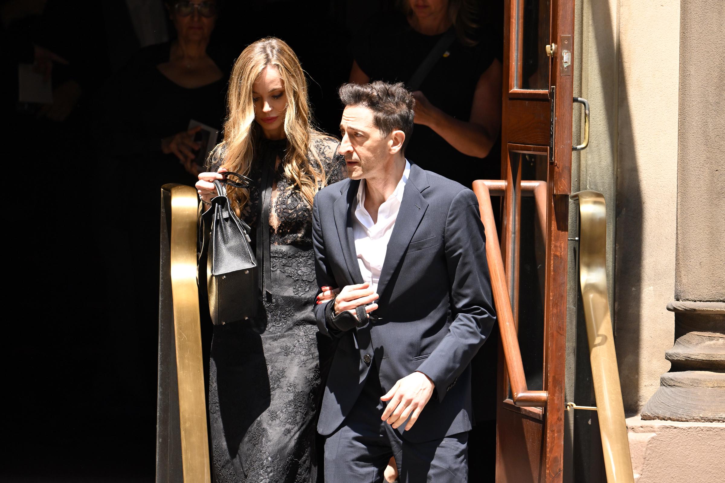 Among those paying tribute to Clive Davis were actress and fashion designer Georgina Chapman and Oscar-winning actor Adrien Brody, who attended the New York City memorial service together. | Source: Getty Images