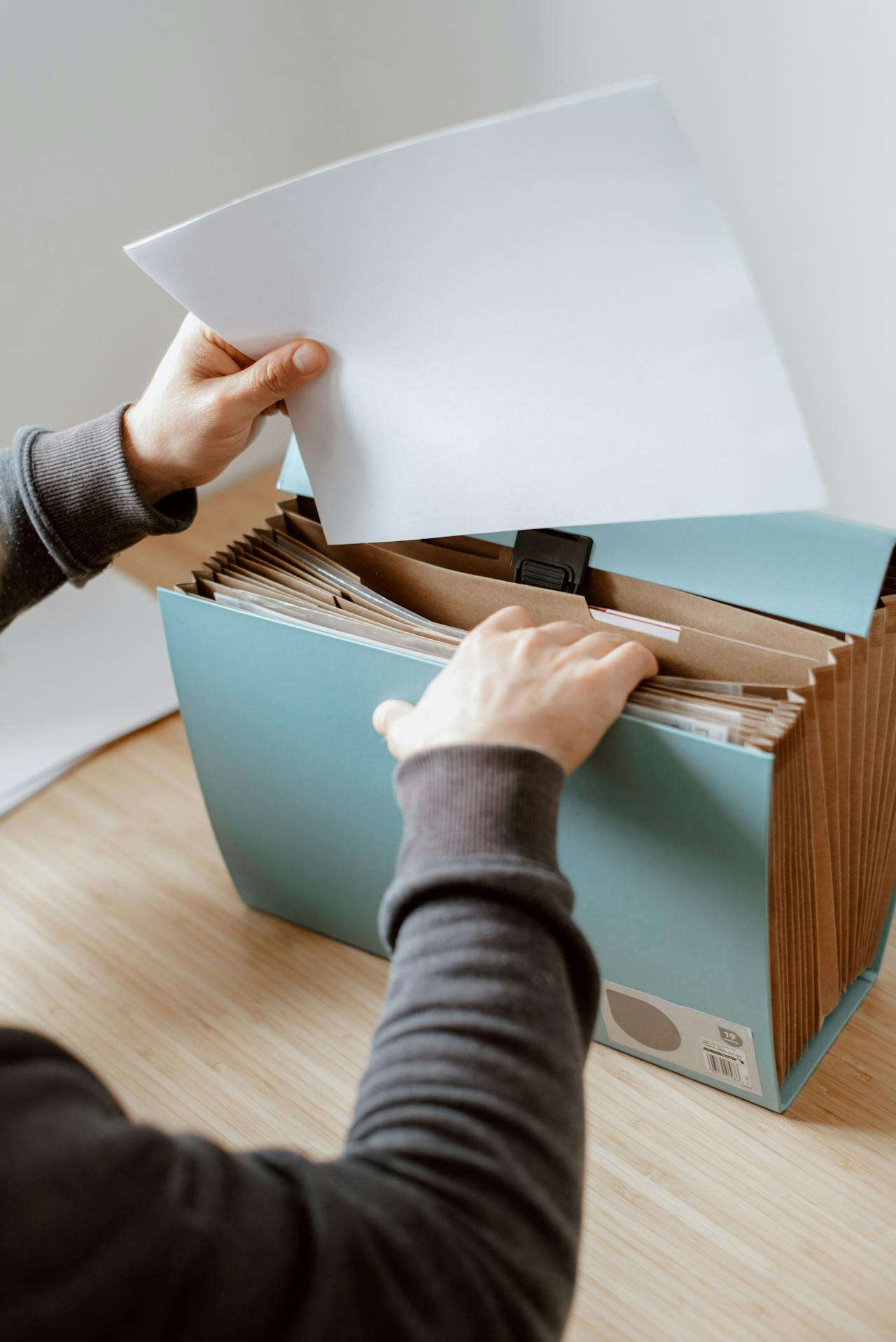 A man taking a document from a briefcase | Source: Pexels