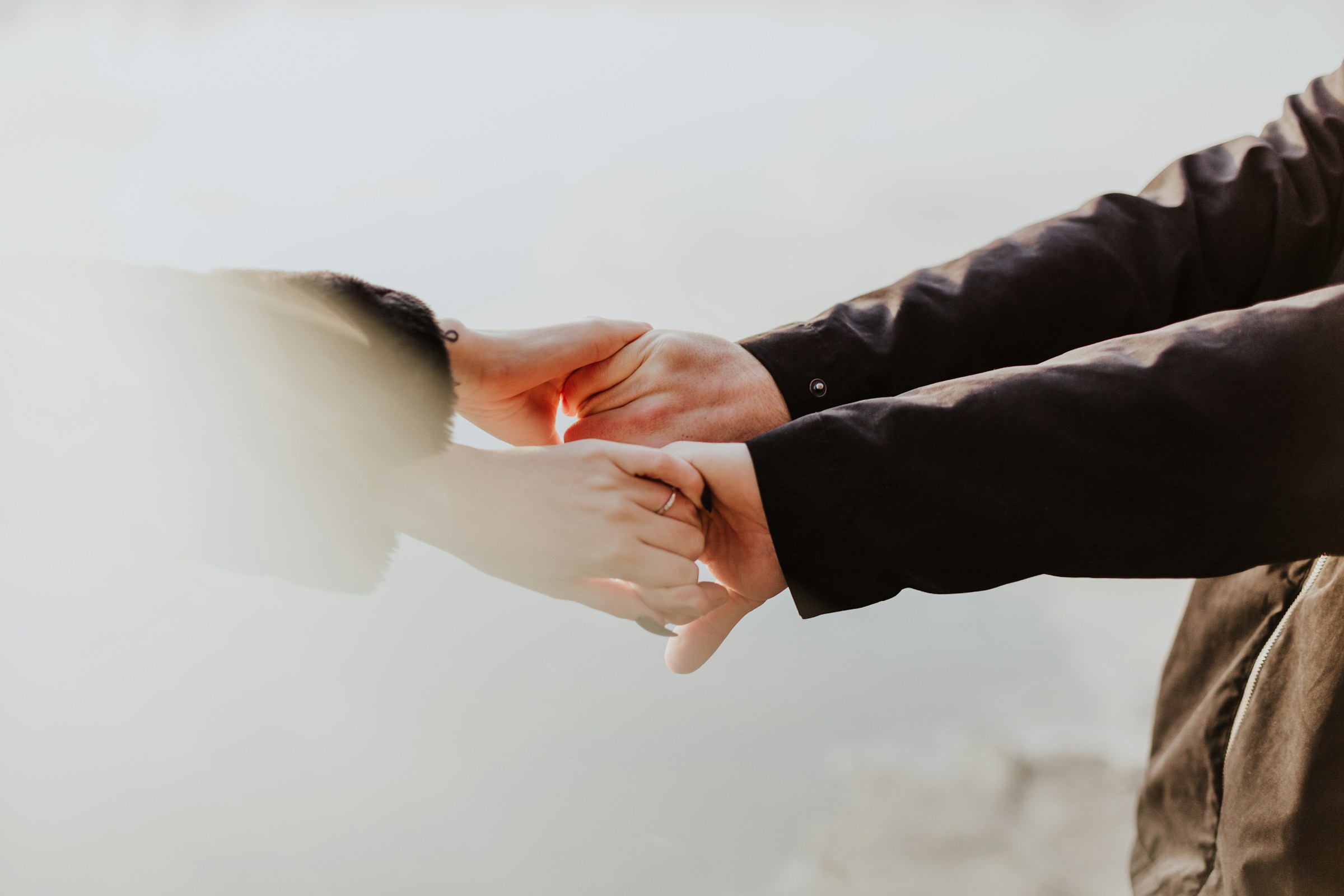 A young couple holding hands | Source: Unsplash