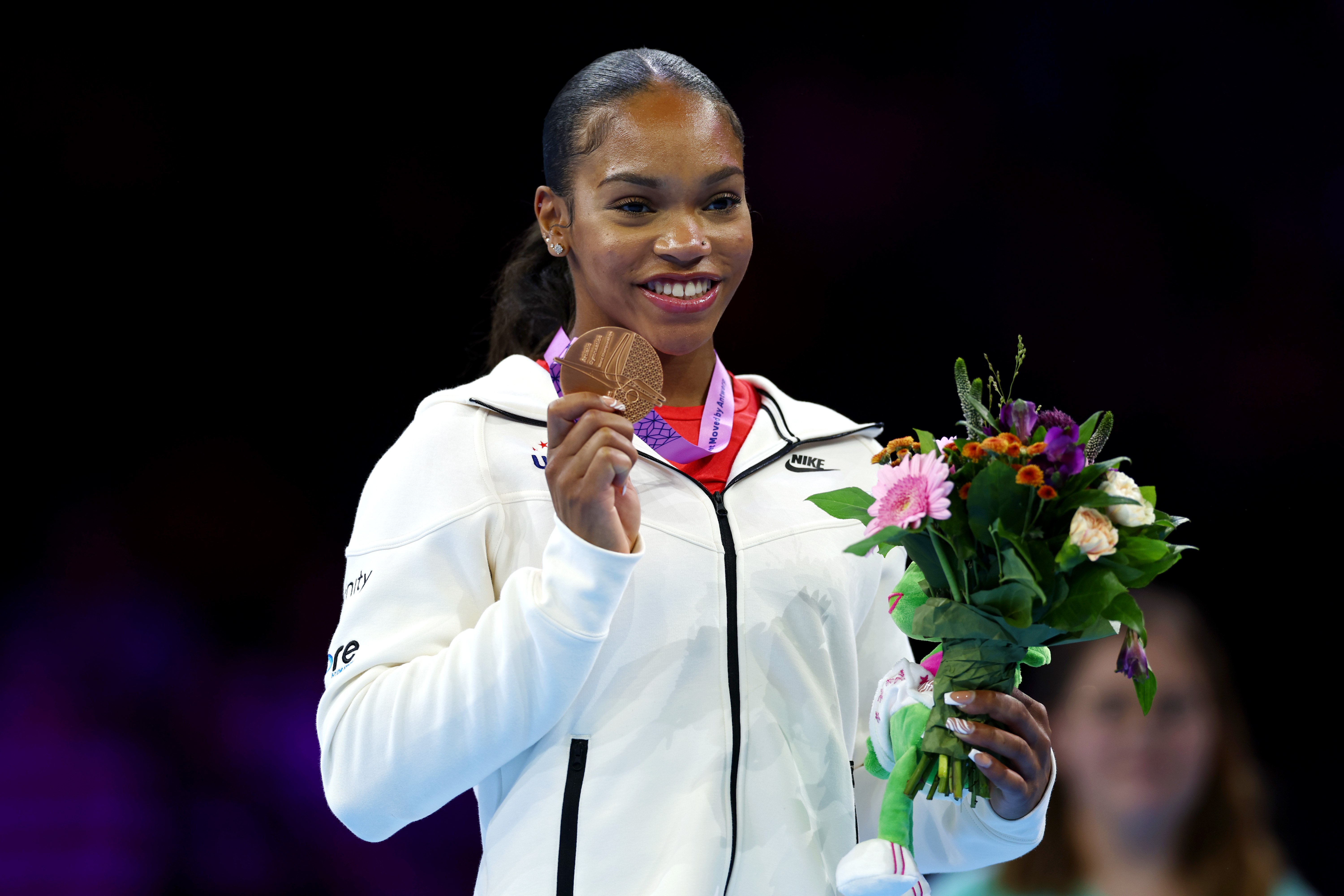 Shilese Jones poses for a photo during the medal ceremony for the Women's Uneven Bars Final on October 7, 2023, in Antwerp, Belgium. | Source: Getty Images