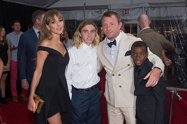 acqui Ainsley, Rocco Ritchie, Guy Ritchie and David Ciccone Ritchie attend "The Man From U.N.C.L.E." New York Premiere at the Ziegfeld Theater on August 10, 2015 in New York City | Photo: Getty Images