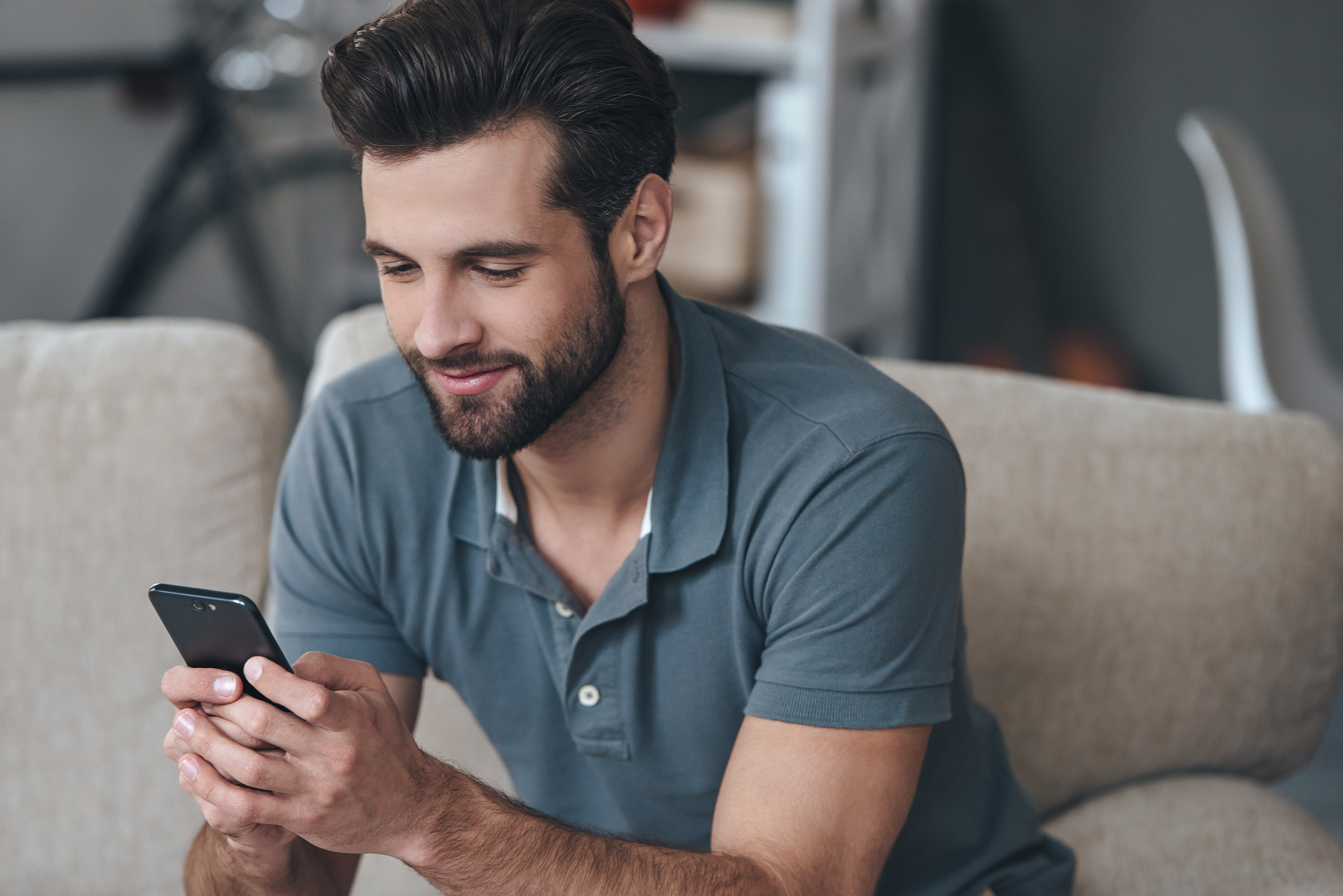 A man using his phone | Source: Shutterstock