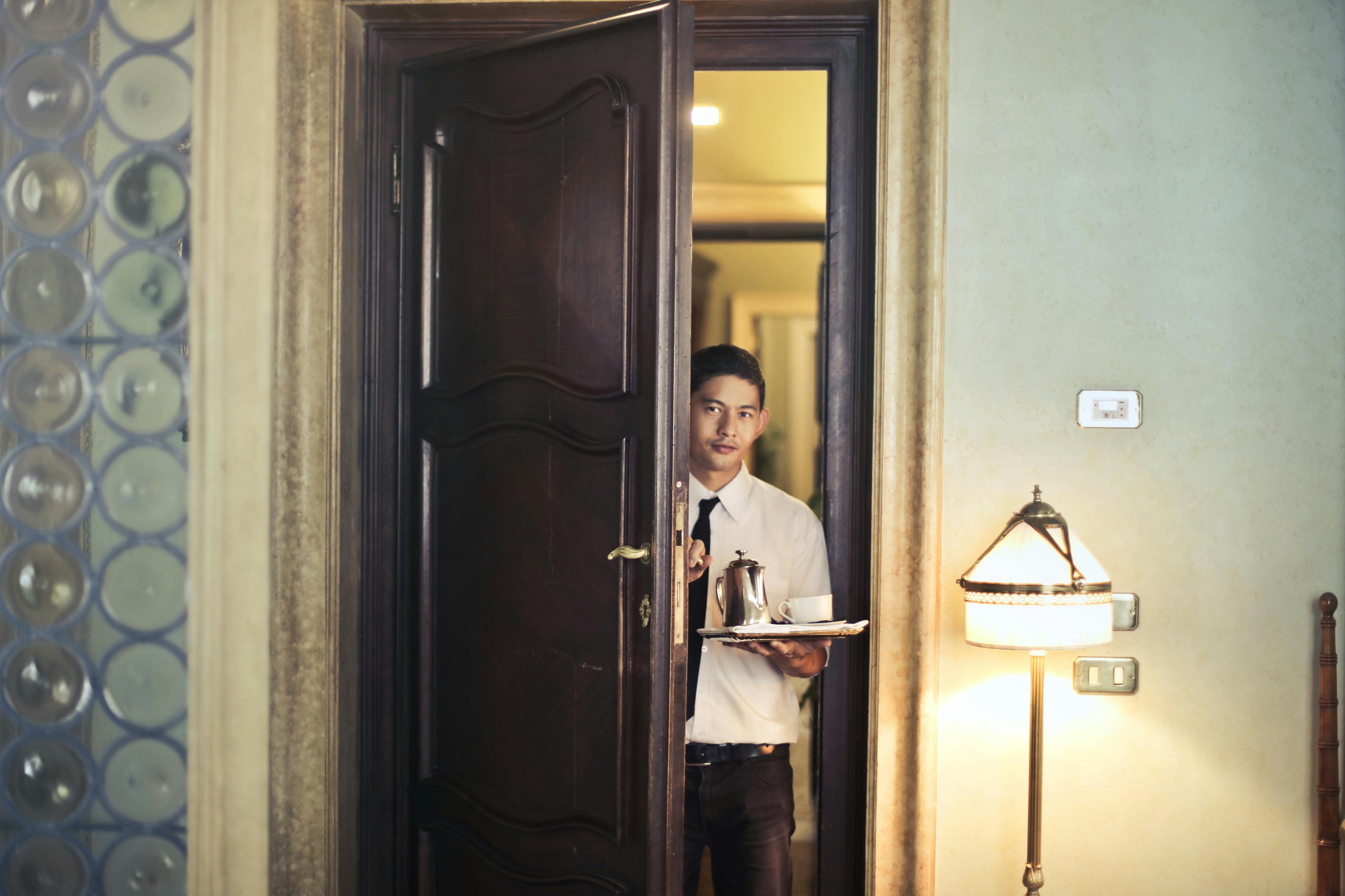 Hotel manager entering a room | Source: Pexels