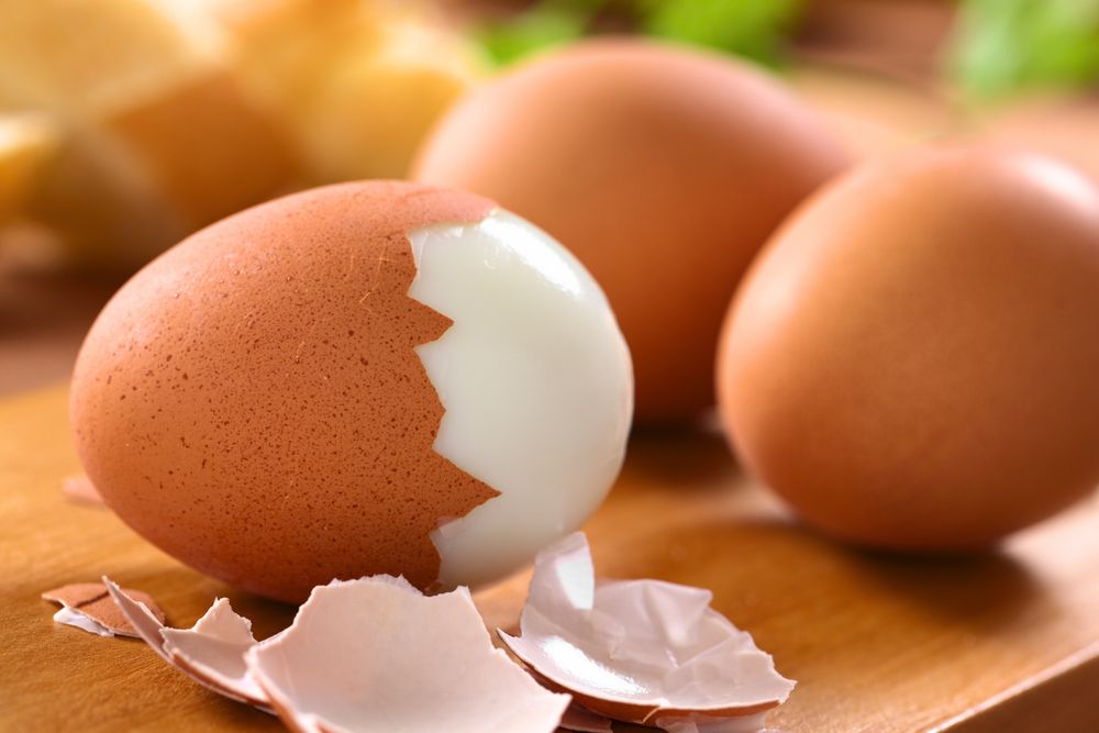 A half-peeled hard boiled egg. | Source: Shutterstock
