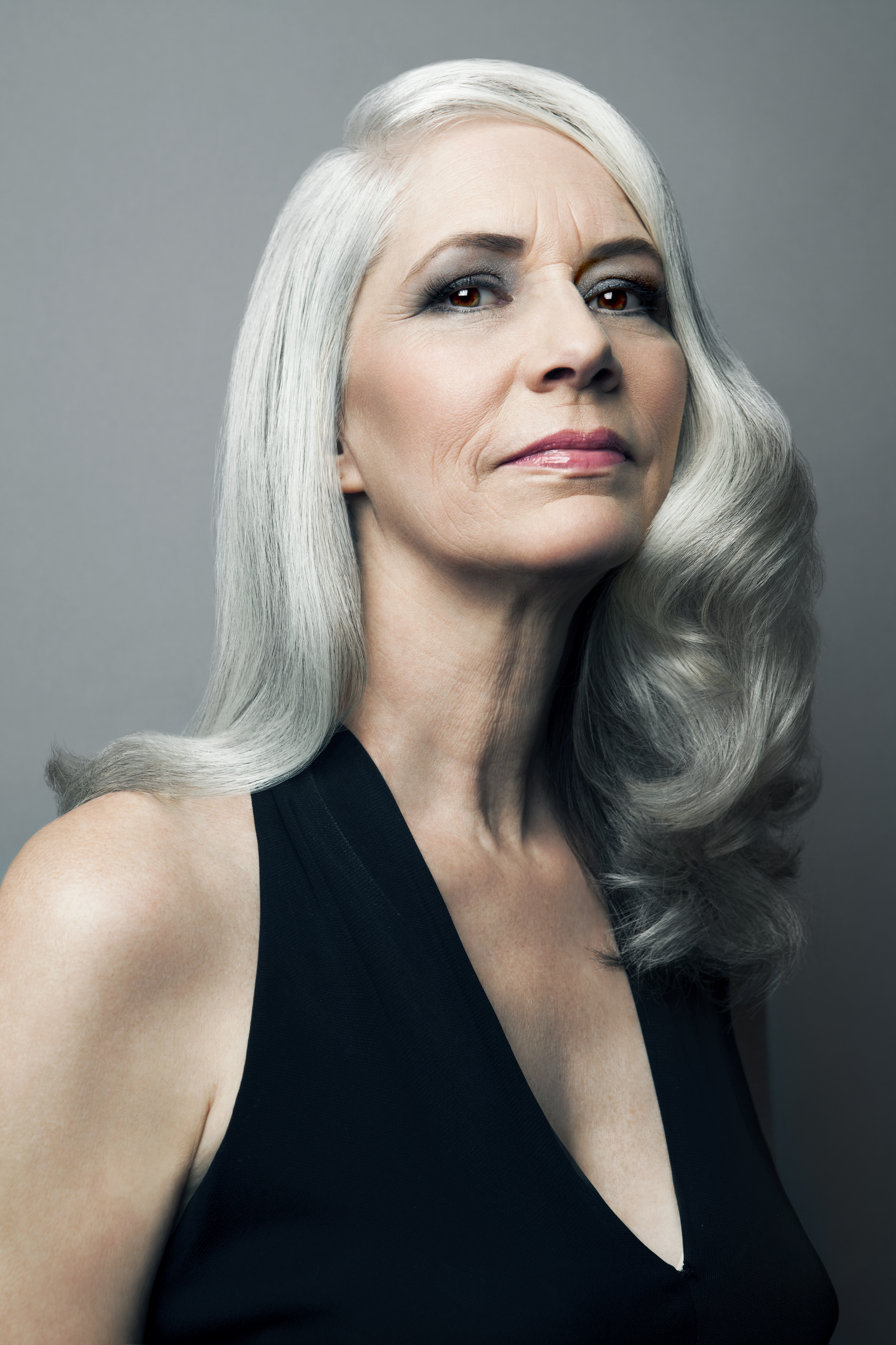 A senior woman in a black dress | Source: Getty Images