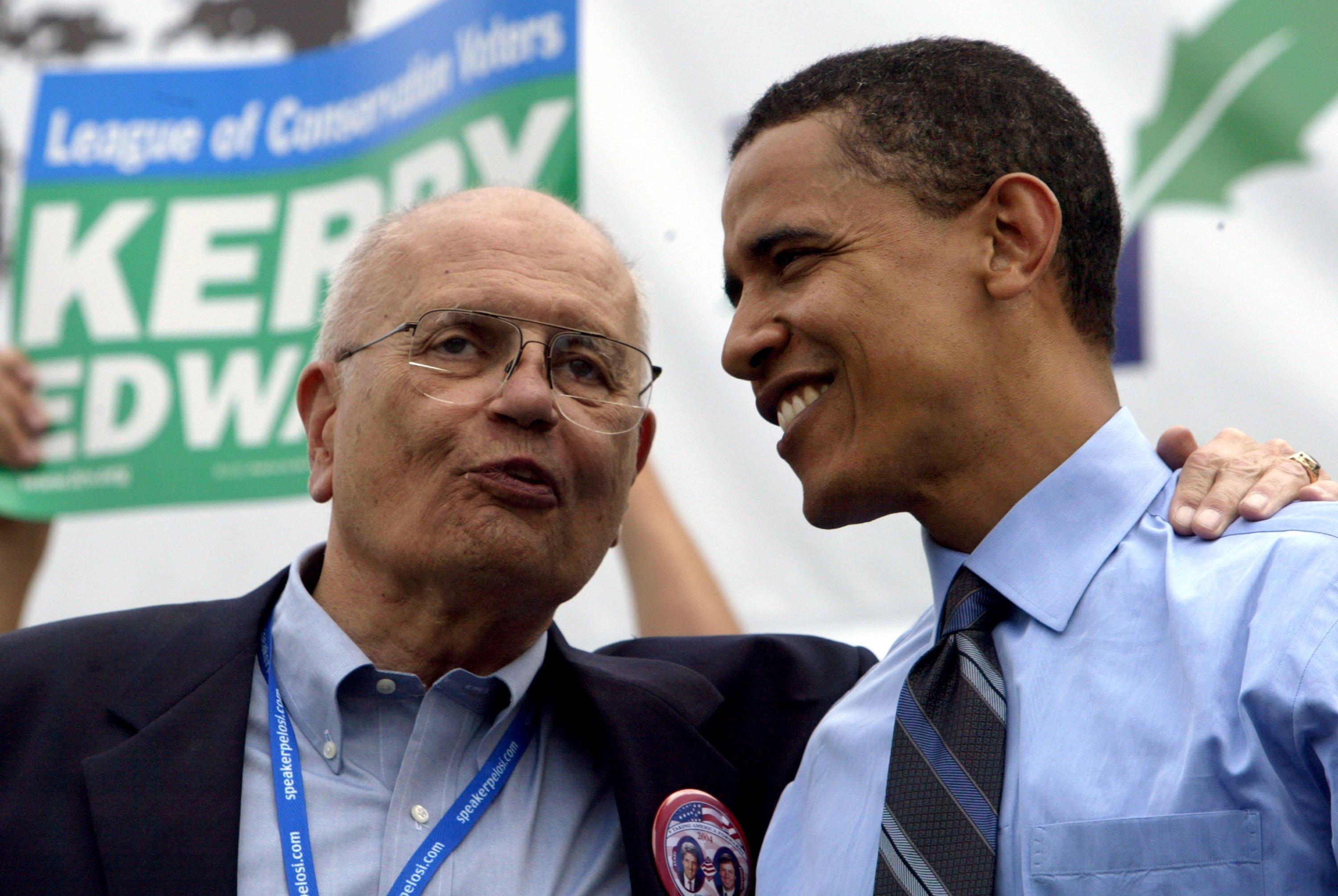 Former President Barack Obama chatting with Rep. John Dingell at the League of Conservation Voters Environmental Victory Rally | Photo: Getty Images 