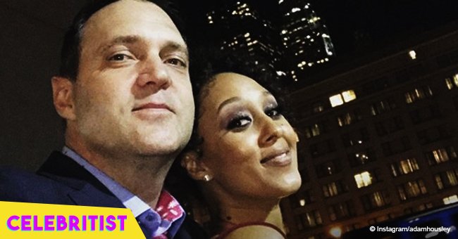 Tamera Mowry rocks red lipstick and black outfit on date night with husband 