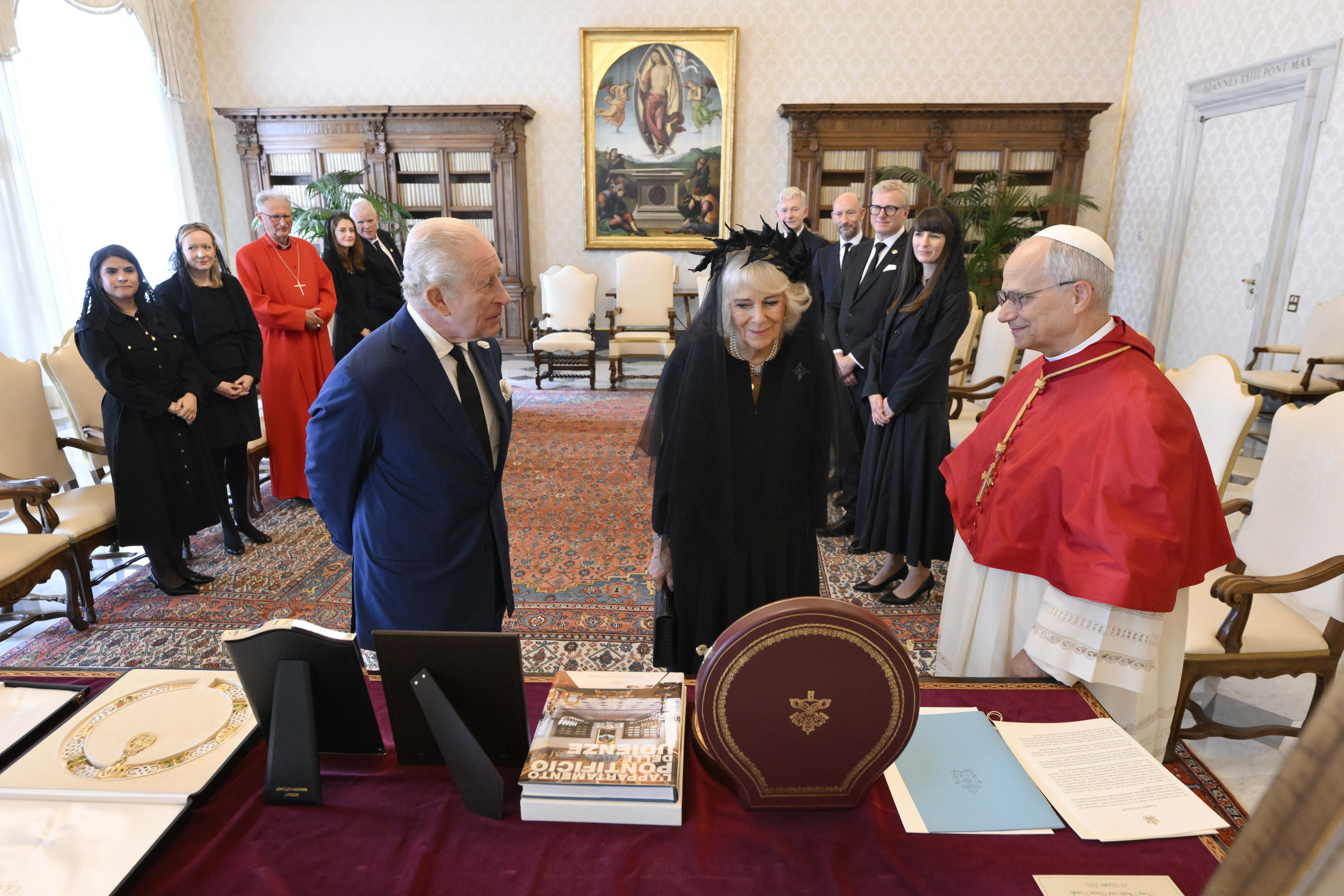 Pope Leo XVI exchanges gifts with King Charles III and Queen Camilla during an audience at the Apostolic Palace on October 23, 2025 | Source: Getty Images