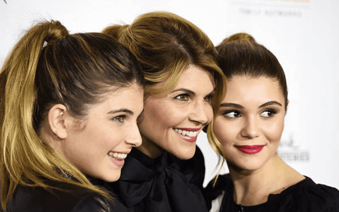 Lori Loughlin, Isabella Giannulli and Olivia Giannulli on the red carpet for the premiere of "Northpole," on November 4, 2014, in Los Angeles, California | Source: Getty Images (Photo by Amanda Edwards/WireImage)