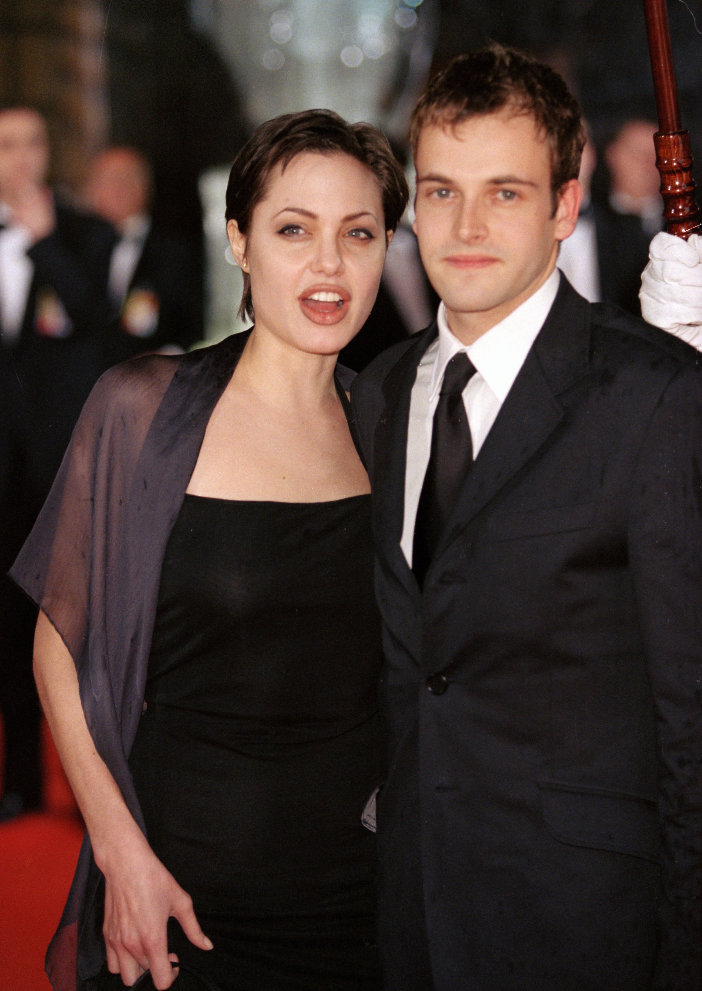 Angelina Jolie & Jonny Lee Miller Attend The Bafta British Academy Film Awards At London's Grosvenor House Hotel. in 1998 | Source: Getty Images