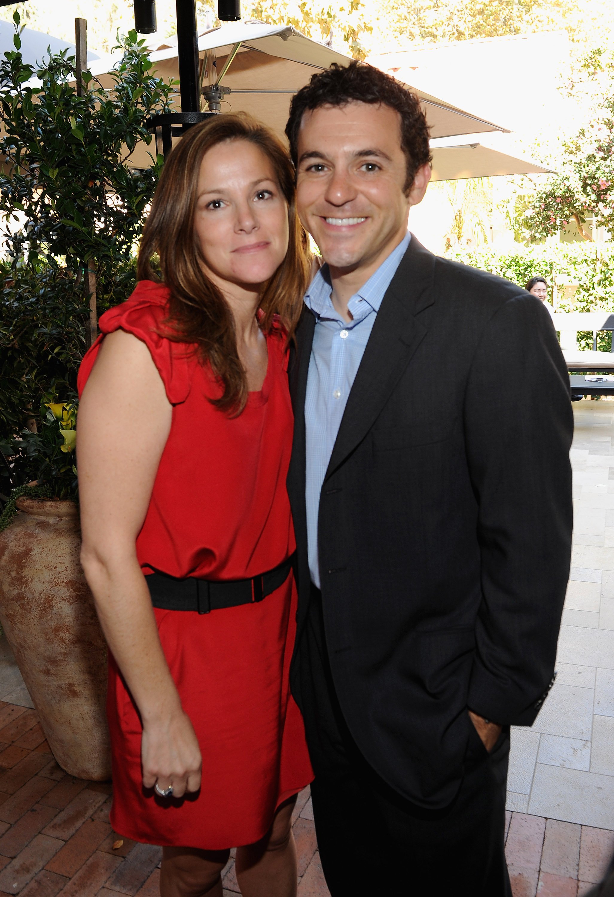 Fred Savage (R) and Jennifer Lynn Stone attend The First Annual Los Angeles Food & Wine Hosts Wolfgang Puck's Sunday Brunch & Charity Auction at Wolfgang Puck at Hotel Bel-Air on October 16, 2011 | Source: Getty Images