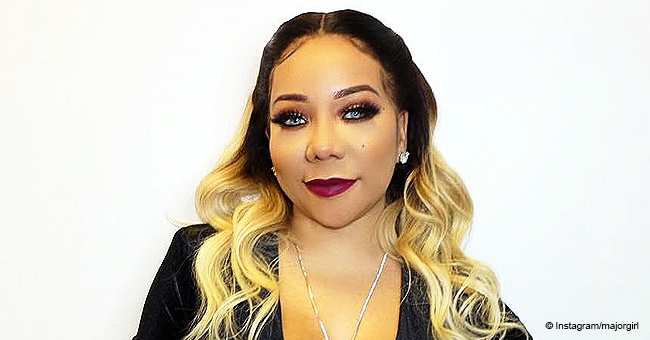 Tiny Harris Is a Bombshell in Blonde Ombre Waves and a Black Dress (Photo)