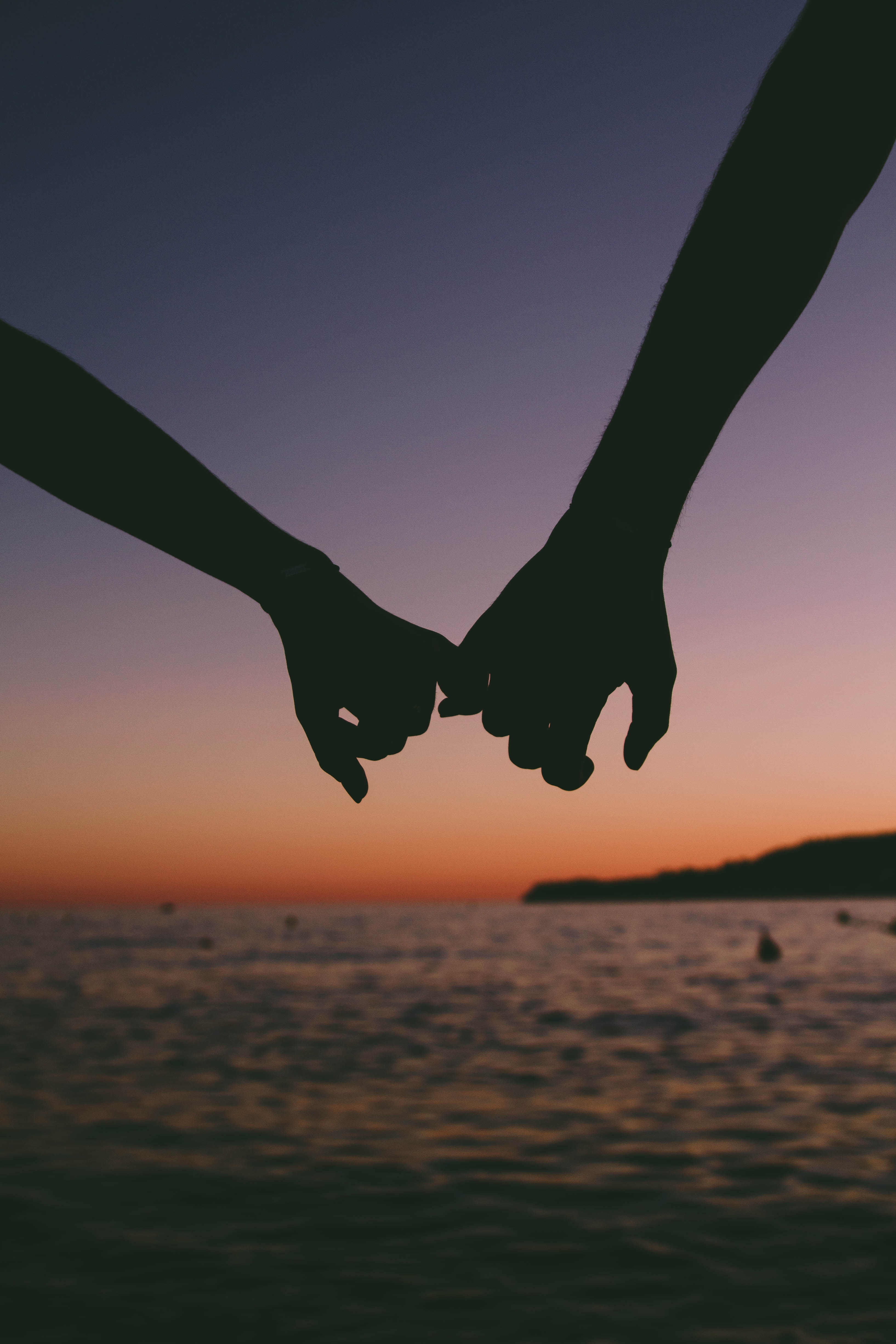 Two Person Holding Pinkies. | Source: Pexels