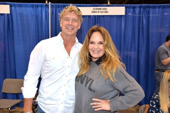 John Schneider and Catherine Bach at the Anaheim Convention Center at Anaheim, California on September 29, 2019. | Photo: Getty Images
