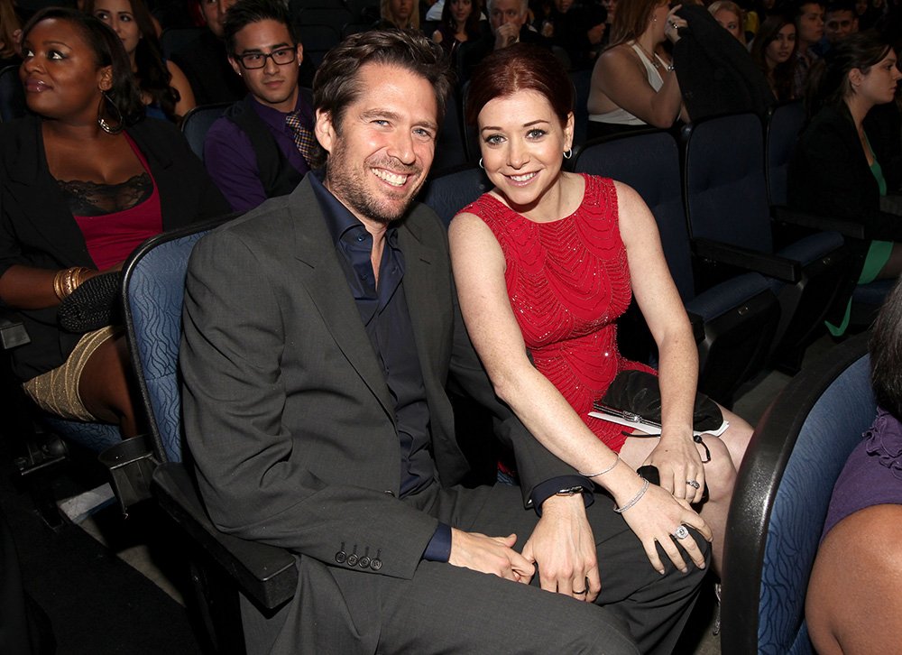 Alexis Denisof and Alyson Hannigan pose in the audience during the 2012 People's Choice Awards at Nokia Theatre L.A. Live on January 11, 2012 in Los Angeles, California. I Image: Getty Images.