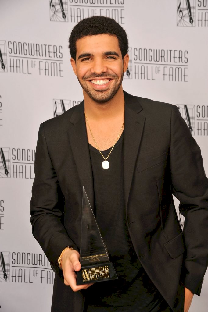 Drake poses at the Songwriters Hall of Fame 42nd Annual Induction and Awards at The New York Marriott Marquis Hotel - Shubert Alley on June 16, 2011, in New York City. | Photo by Gary Gershoff/Getty Images for Songwriters Hall of Fame