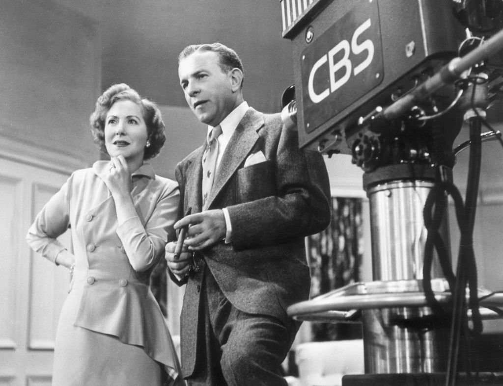 American comedy team George Burns (1896 - 1996) and Gracie Allen (1902 - 1964) standing next to a television camera on the set of their TV series 'The George Burns and Gracie Allen Show' on January 01, 1955. | Photo: Getty Images