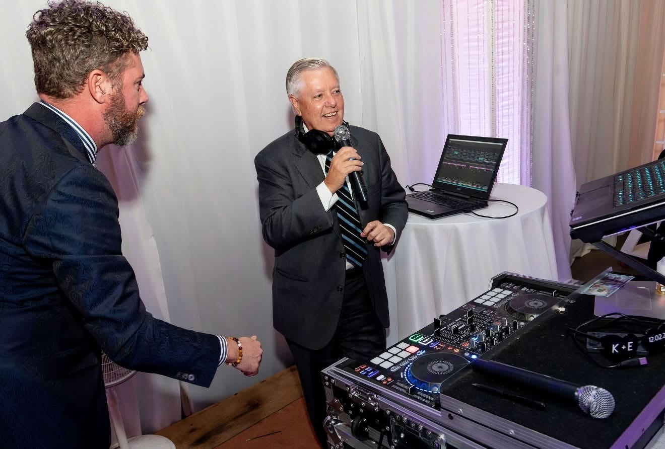 Emillie Roberts revealed during her eulogy that her uncle tried to DJ at her wedding. Here's a photo of that moment posted on July 14, 2026. | Source: Facebook/Emillie Roberts