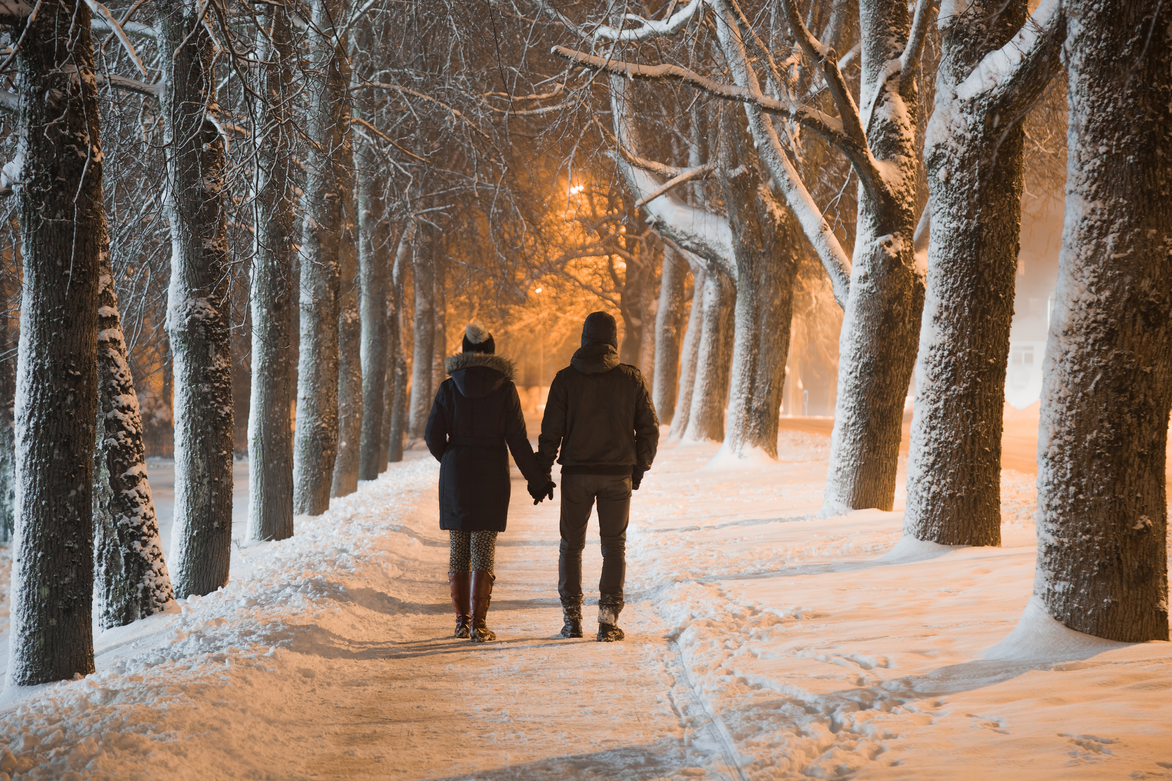 A couple holding each other hands in winter | Source: Shutterstock