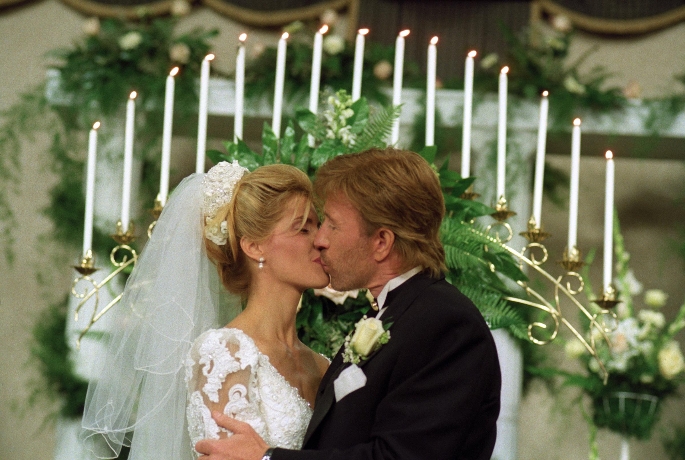 Chuck Norris and Gena O’Kelley kissing on their wedding day at North Church in Carrollton, Texas. | Source: Getty Images