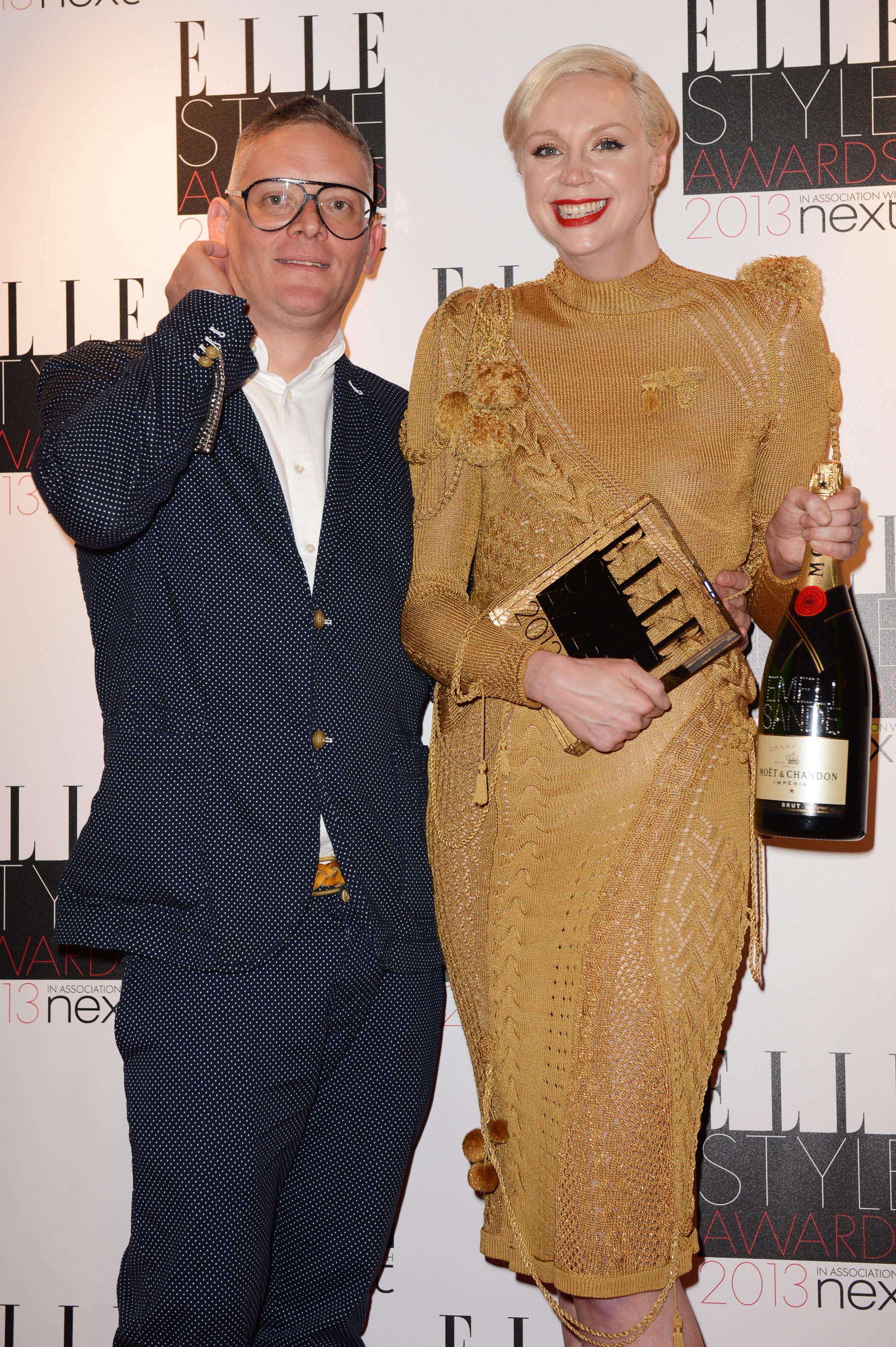 Gwendoline Christie is posing with Giles Deacon after he presented the Best TV Show Award for Game Of Thrones at The Elle Style Awards in London | Source: Getty Images