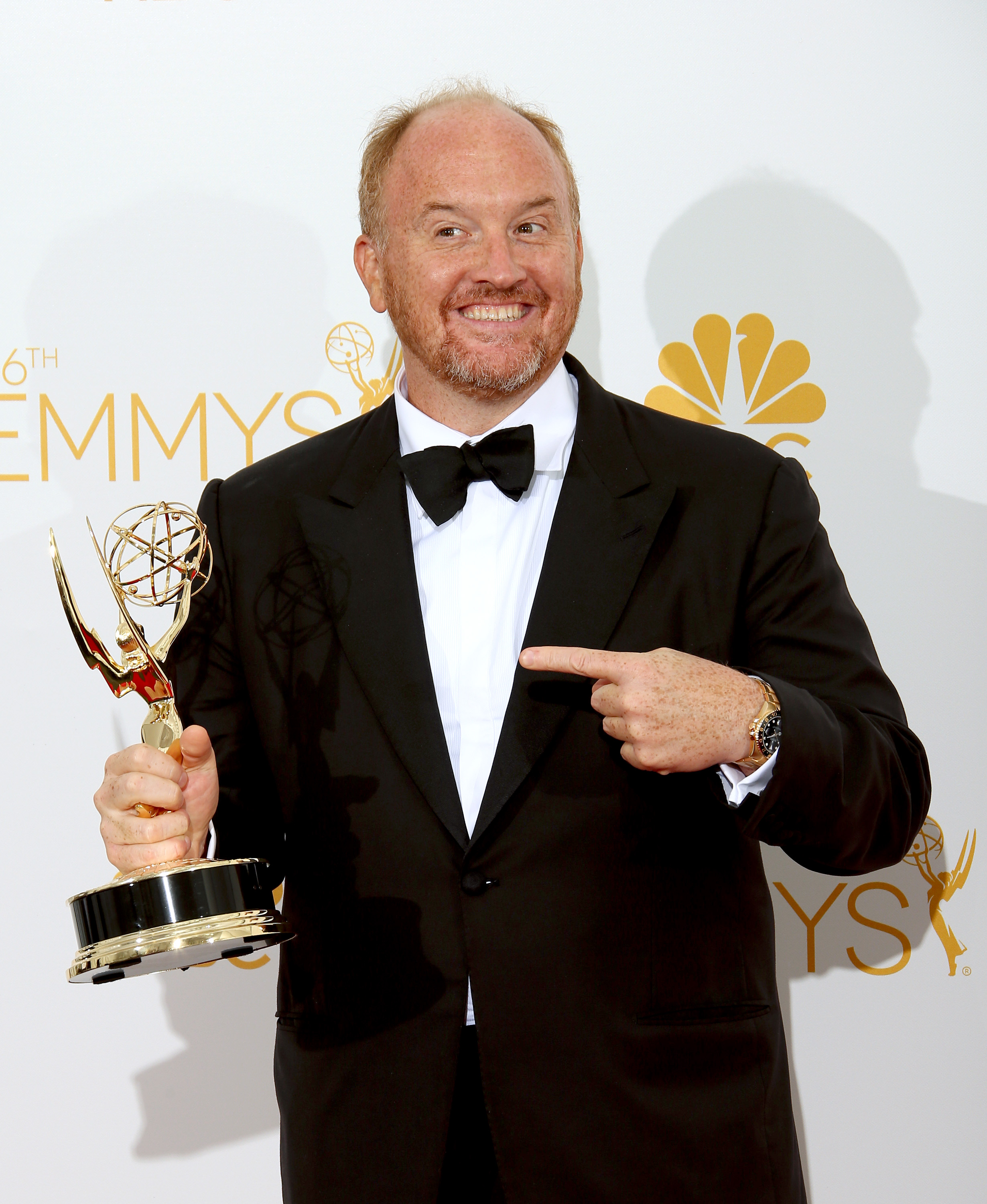 Louis C.K. poses with his award for Outstanding Writing for a Comedy Series for "Louie" at Nokia Theatre L.A. Live on August 25, 2014, in Los Angeles, California. | Source: Getty Images