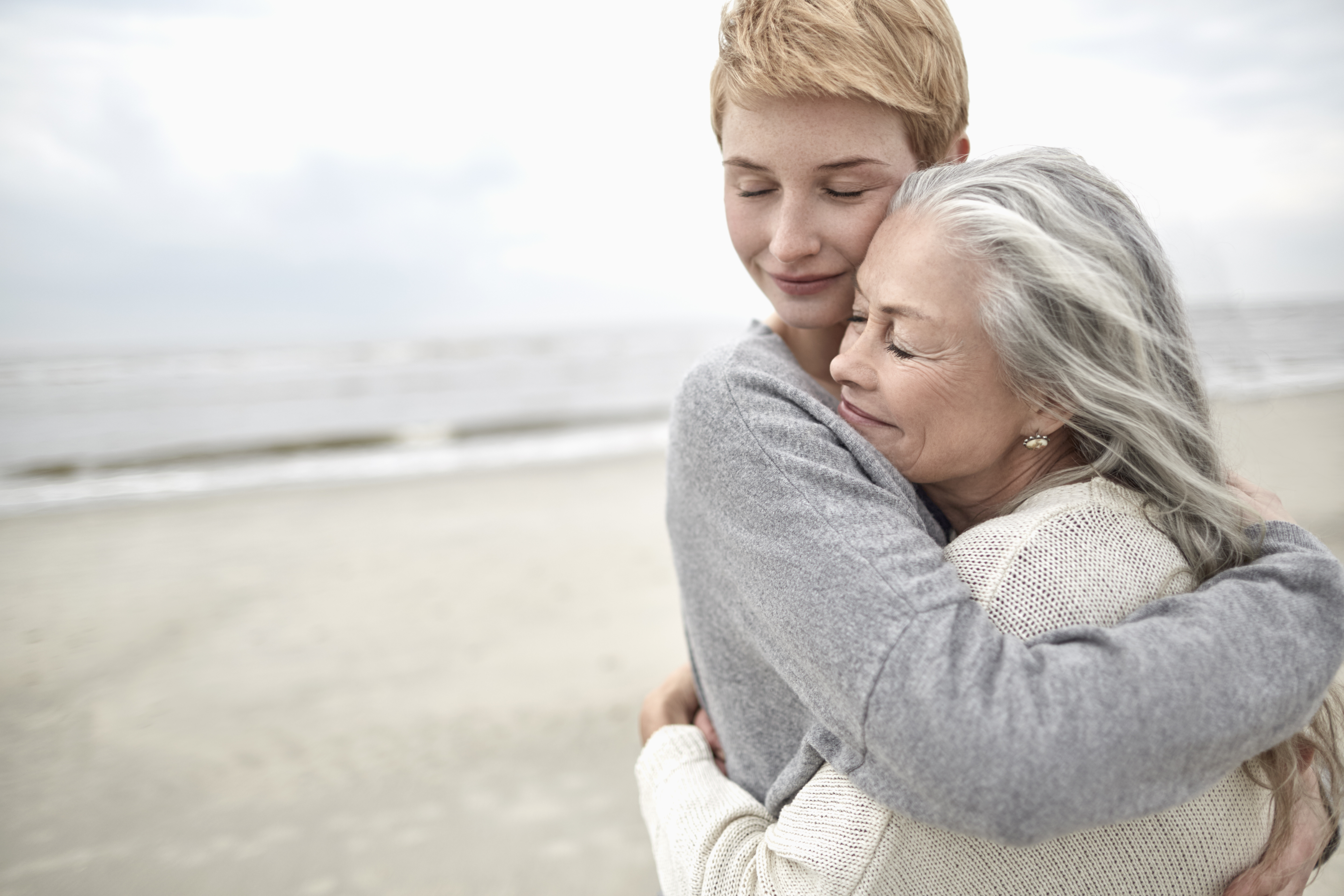 An older and younger woman hugging | Source: Getty Images
